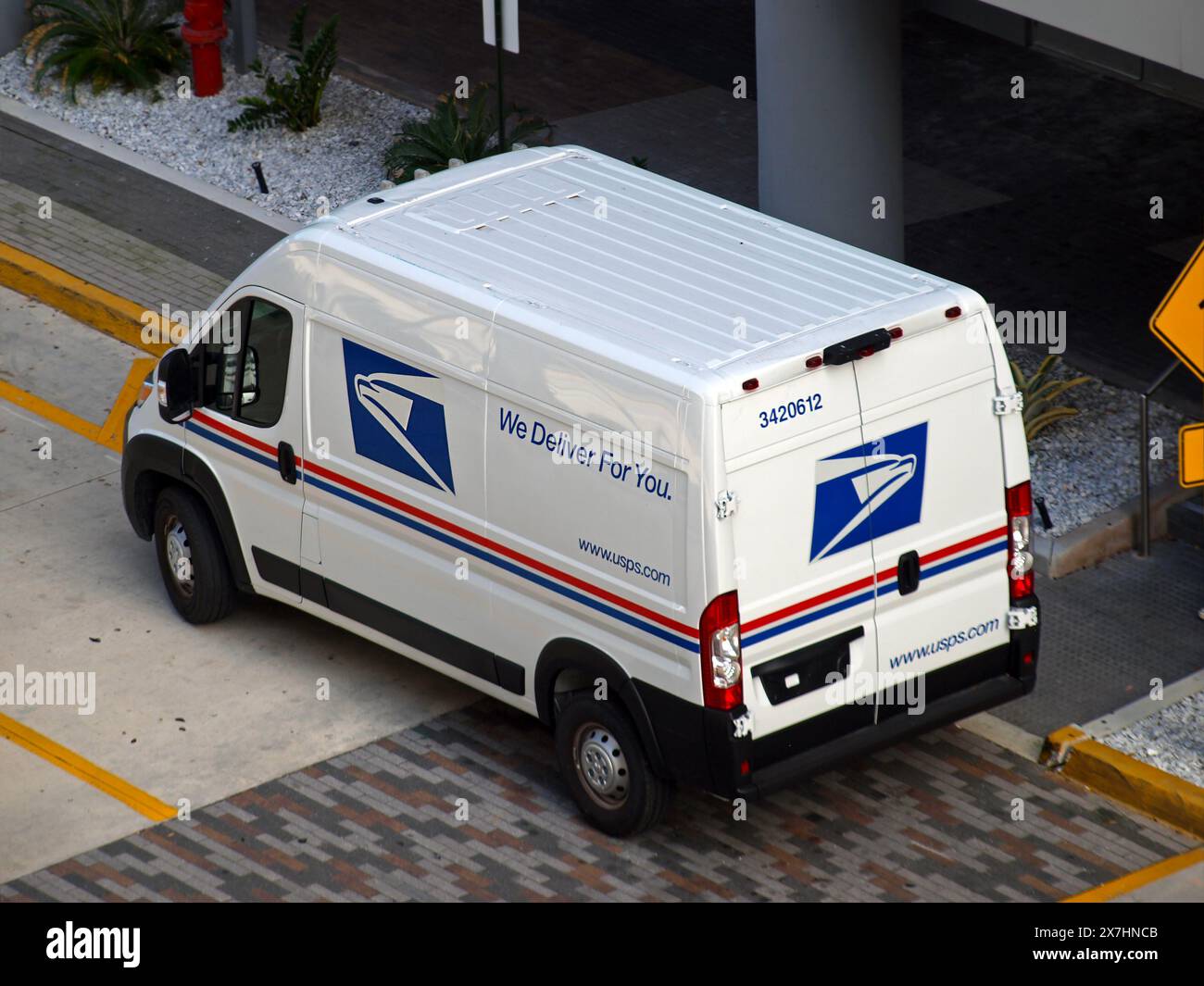 Miami, Florida, United States - April 6, 2024: Vehicle of the United States Postal Service parked in a street. Only for editorial use. Stock Photo