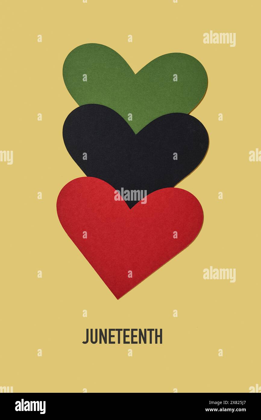 the text juneteenth and three hearts with the colors of the black liberation flag, green, black and red, aka afro-american flag Stock Photo