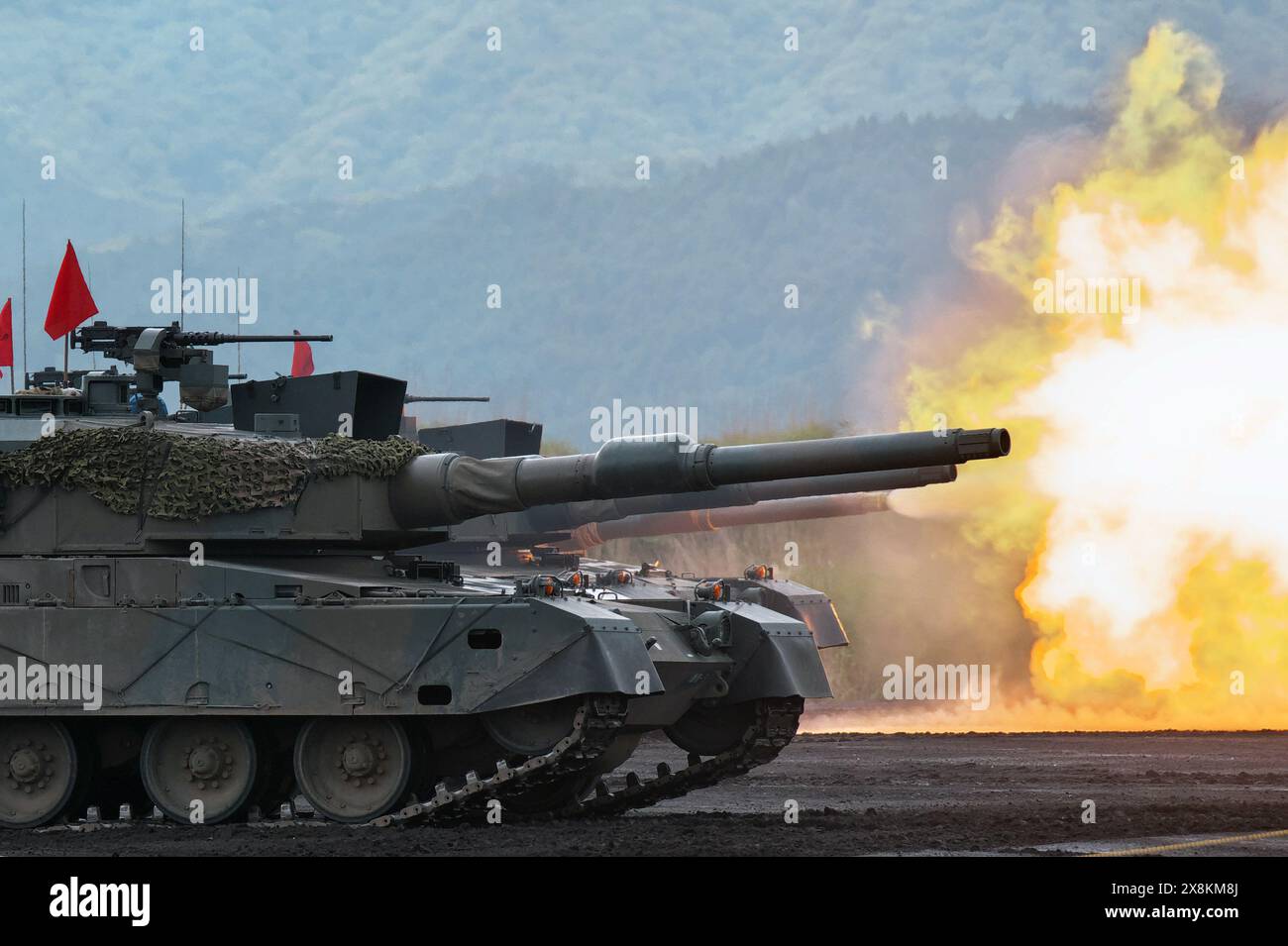 Gotemba, Japan. 26th May, 2024. Japan Ground Self-Defense Force's Type 90 tanks fires during the live-firing exercise 'Fuji Comprehensive Firepower Exercise 2024' at the Higashi Fuji training field in Shizuoka-prefecture, Japan on Sunday, May 26, 2024. Photo by Keizo Mori/UPI Credit: UPI/Alamy Live News Stock Photo