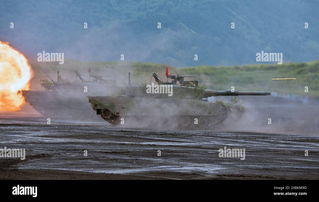 Gotemba, Japan. 26th May, 2024. Japan Ground Self-Defense Force's Type 10 tanks fires during the live-firing exercise 'Fuji Comprehensive Firepower Exercise 2024' at the Higashi Fuji training field in Shizuoka-prefecture, Japan on Sunday, May 26, 2024. Photo by Keizo Mori/UPI Credit: UPI/Alamy Live News Stock Photo