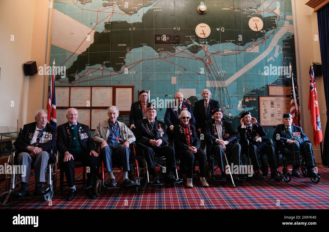 Normandy veterans pose for a photograph in the Map room at Southwick House, during an event hosted by the Spirit of Normandy Trust and D-Day Revisited at Southwick House, the nerve centre of D-Day operations 80 years ago, near Portsmouth, Hampshire. On Tuesday the veterans from D-Day and Normandy will travel by ferry to France to take part in commemorations to mark the 80th anniversary of D-Day on Thursday. Picture date: Monday June 3, 2024. Stock Photo