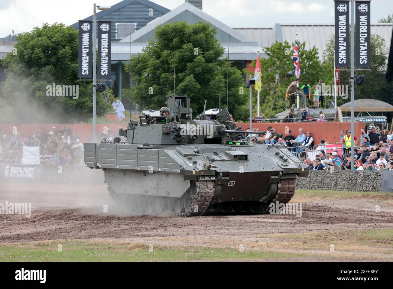 A British Army Ajax armoured reconnaissance vehicle driving around the arena at Bovington Tank Museum during Tankfest 2024 Stock Photo