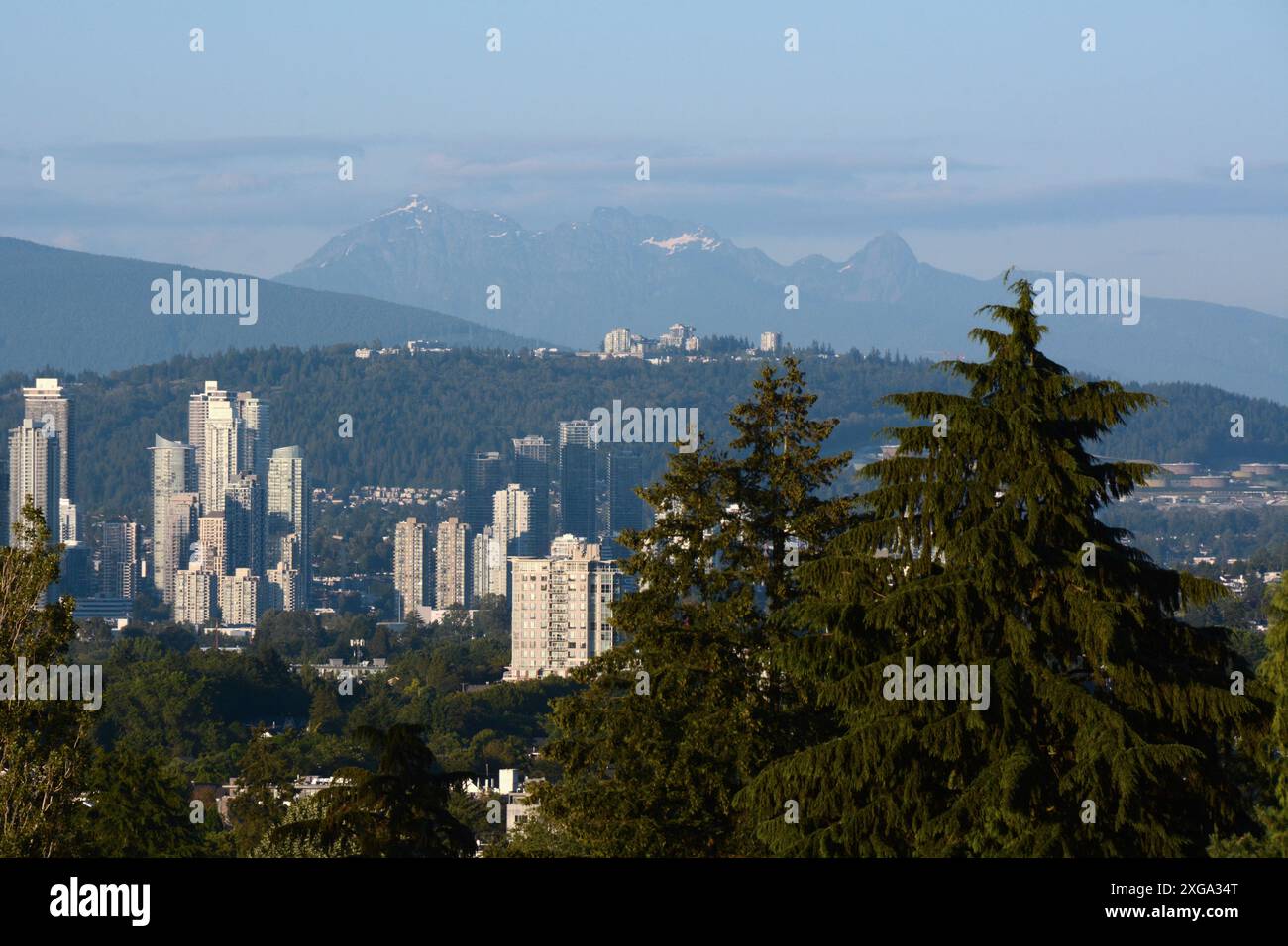 A view of the city of Burnaby, Simon Fraser University, and the Golden Ears group of mountains in the background, Vancouver, British Columbia, Canada. Stock Photo