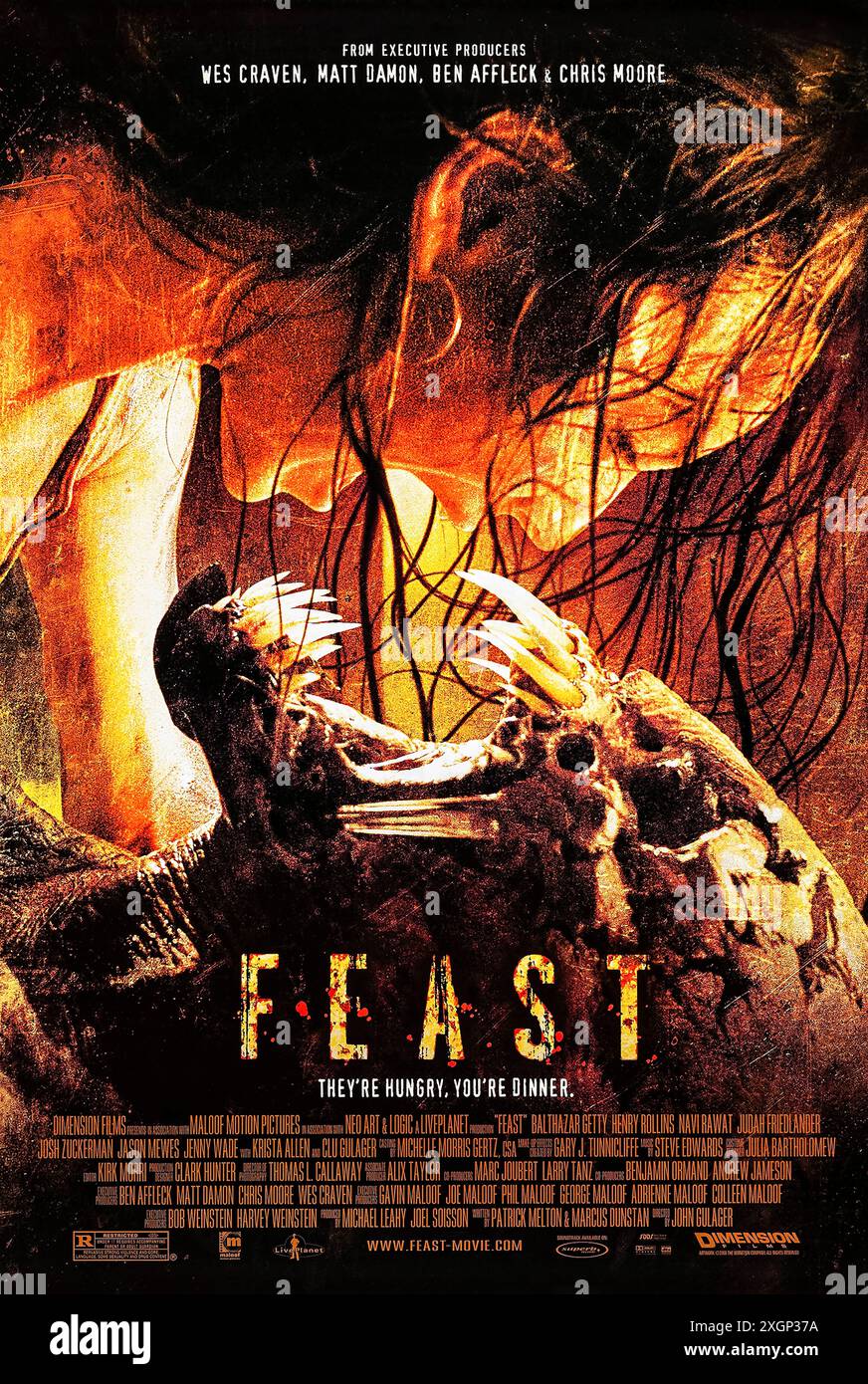 Feast (2005) directed by John Gulager and starring Navi Rawat, Krista Allen and Balthazar Getty. Patrons locked inside a bar are forced to fight monsters. Photograph of an original 2005 US one sheet poster ***EDITORIAL USE ONLY***. Credit: BFA / Dimension Films Stock Photo