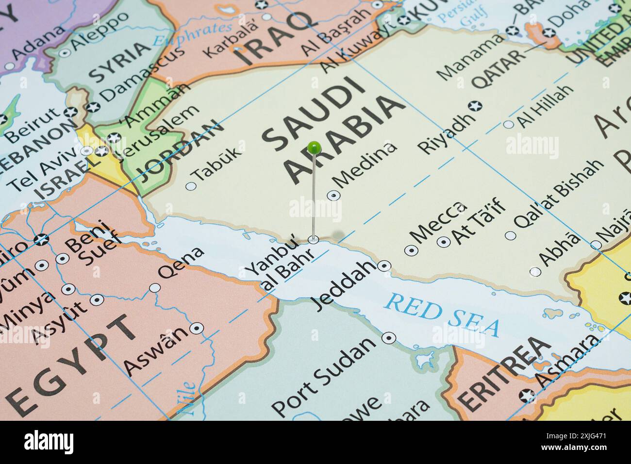 Close up to a Yanbu Al Bahr city with a green pin needle into Saudi Arabia country political map Stock Photo