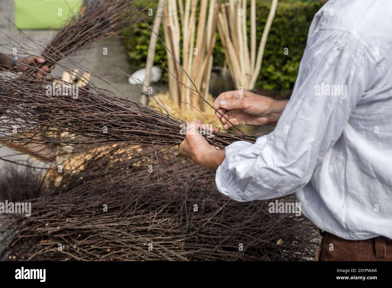 Man tying a whisk Stock Photo