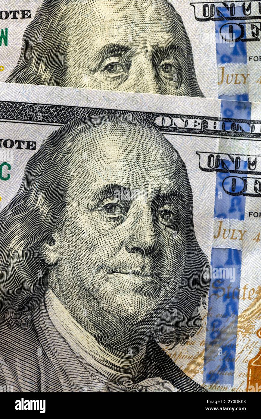 details of a genuine American banknote with a face value of 100, part of a hundred-dollar bill of the United States of America close-up Stock Photo