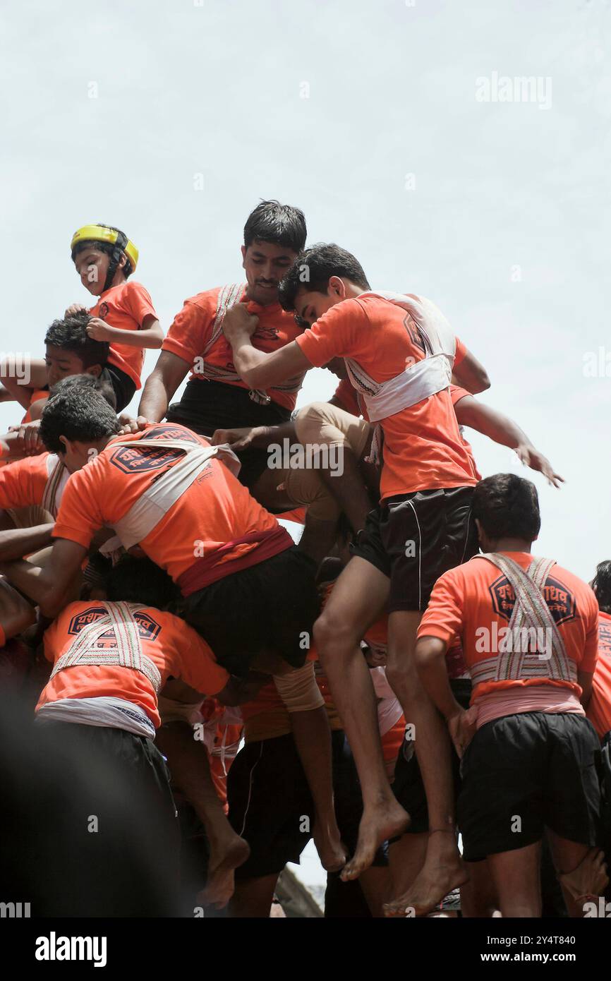 Dadar, Maharashtra / India - August 14, 2009 : A view of the human pyramid is broken down on the day of the Janmashtami festival. Stock Photo