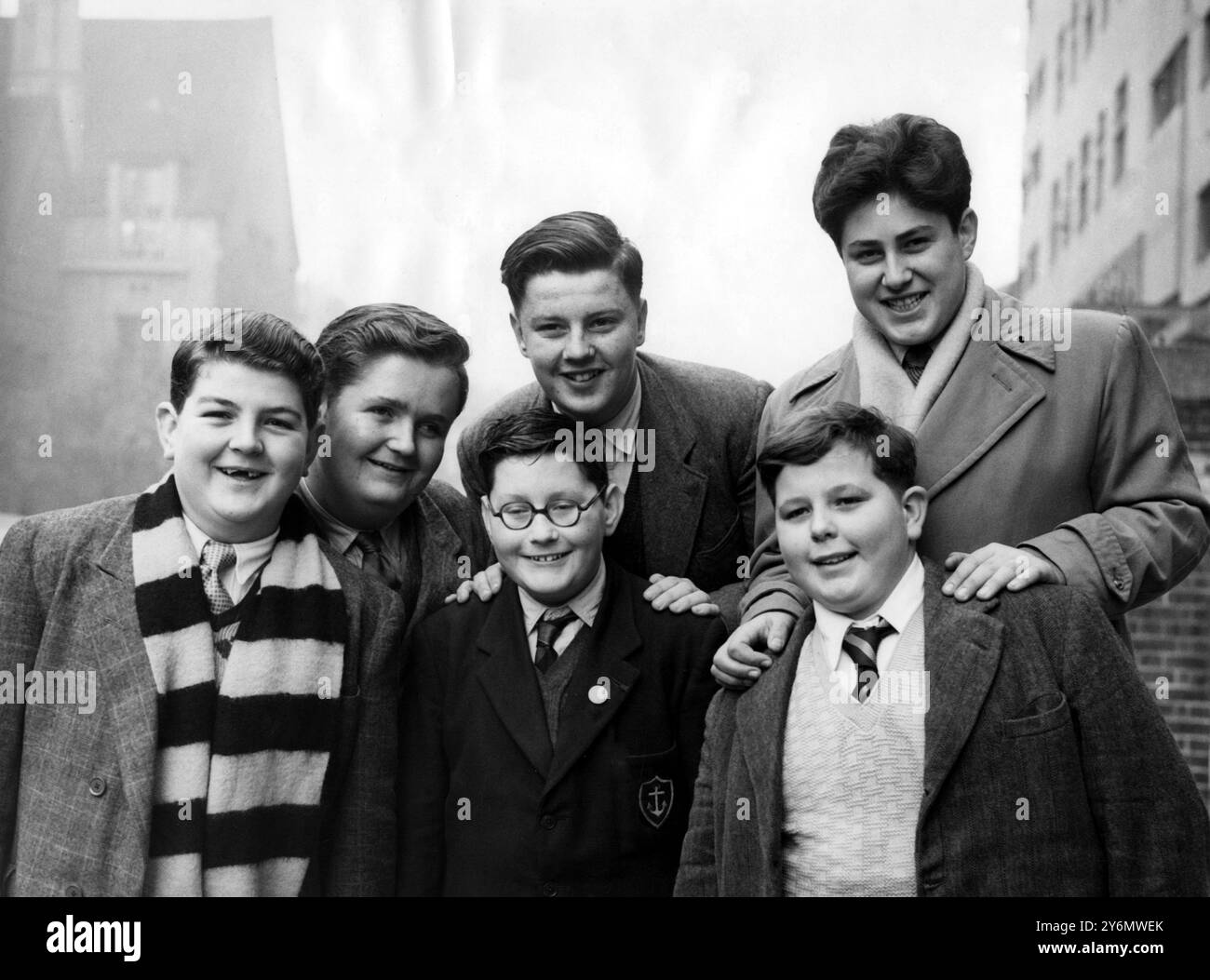 Thirty-eight British schoolboys - all with ample figures - went to Lime Grove television studios, Shepherd's Bush, London, for screen tests.  They are candidates for the role of Billy Bunter, the fat boy of Greyfriars School, in a children's television series for the new year.  The stories are based on the famed writings of Charles Hamilton, now 80 years old - the creator of schoolboy characters whose adventures have been devoured by generations of real-life schoolboys - and will deal with Greyfriars and the doings of Billy Bunter, fattest and greediest boy in the school.  Picture shows three Stock Photo