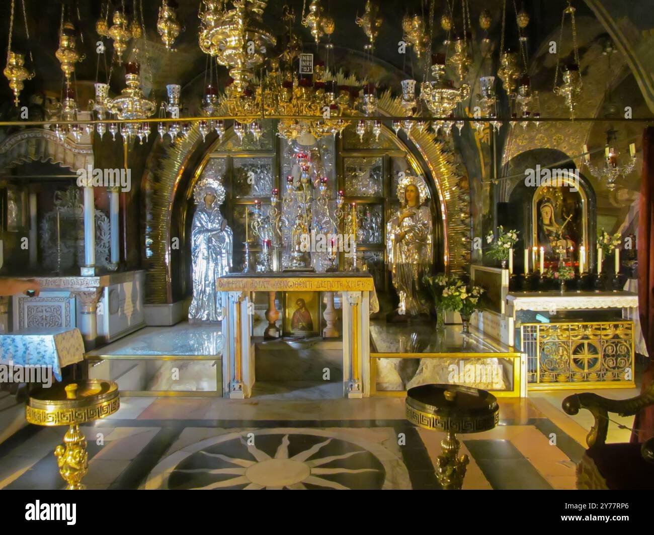 JERUSALEM ISRAEL, May 13, 2015: Golgotha, the place of Jesus' crucifixion within the Basilica of the Holy Sepulcher. Cracked rock from an earthquake d Stock Photo