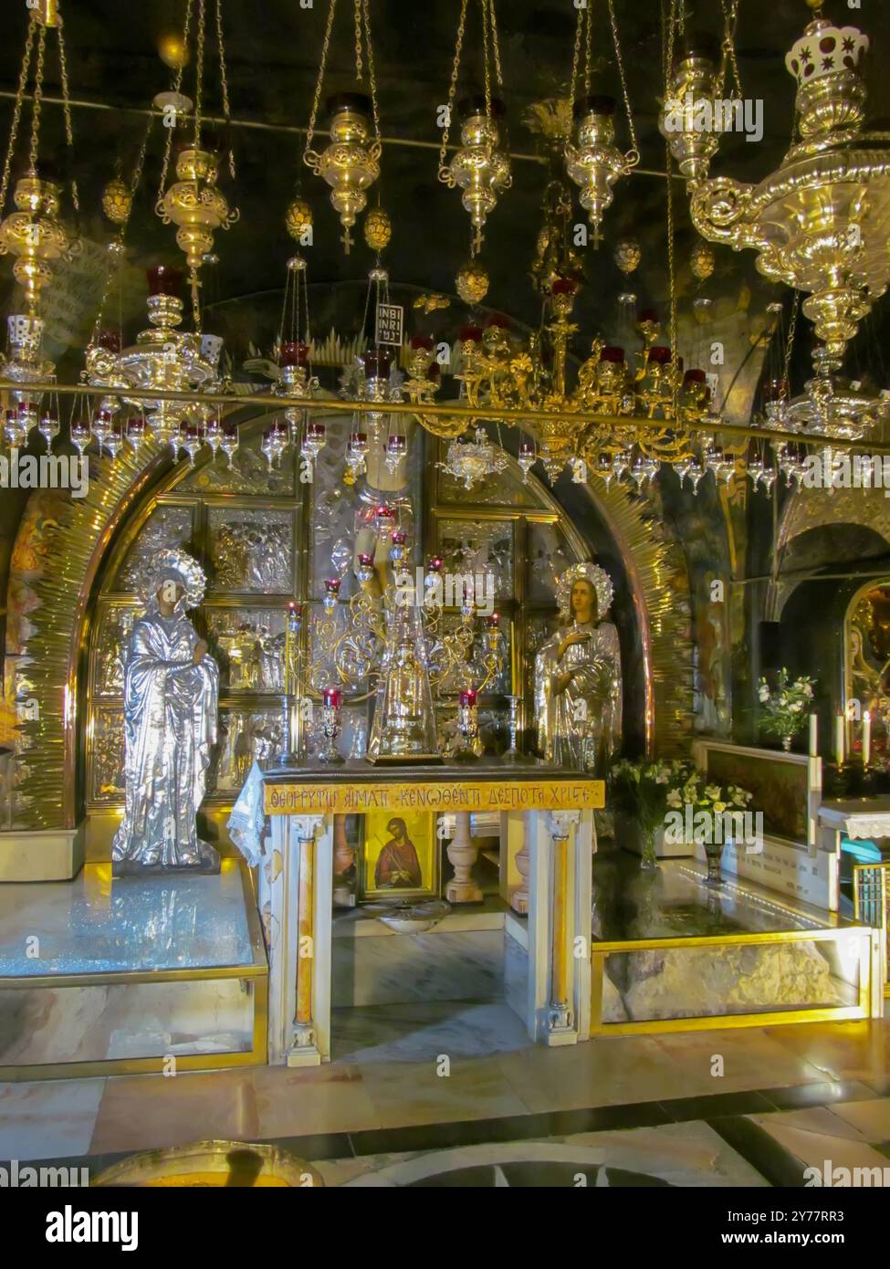 JERUSALEM ISRAEL, May 13, 2015: Golgotha, the place of Jesus' crucifixion within the Basilica of the Holy Sepulcher. Cracked rock from an earthquake d Stock Photo