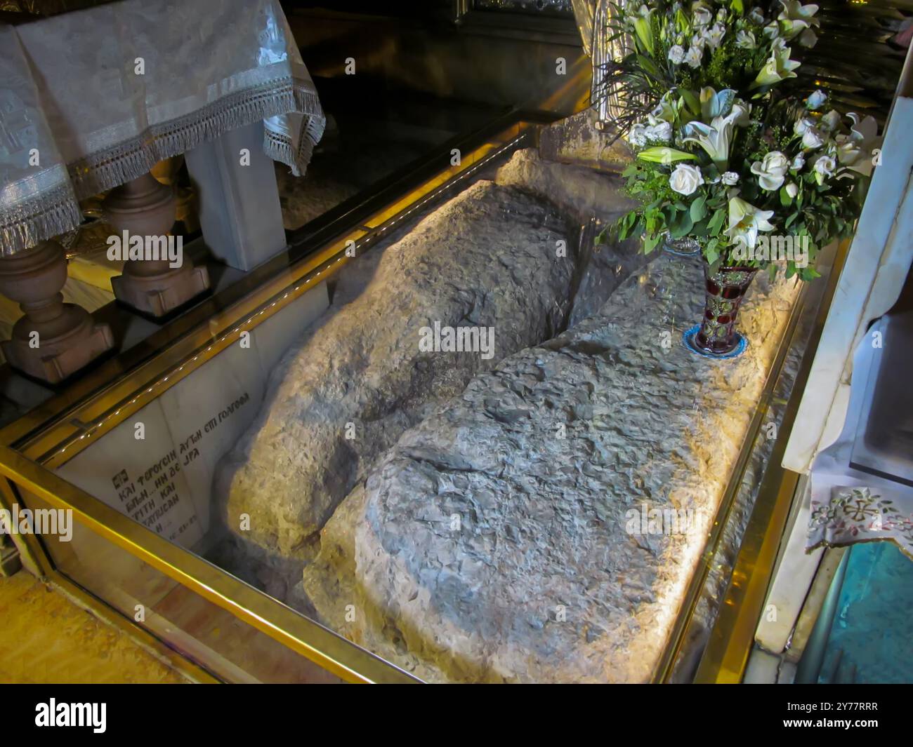 JERUSALEM ISRAEL, May 13, 2015: Golgotha, the place of Jesus' crucifixion within the Basilica of the Holy Sepulcher. Cracked rock from an earthquake d Stock Photo