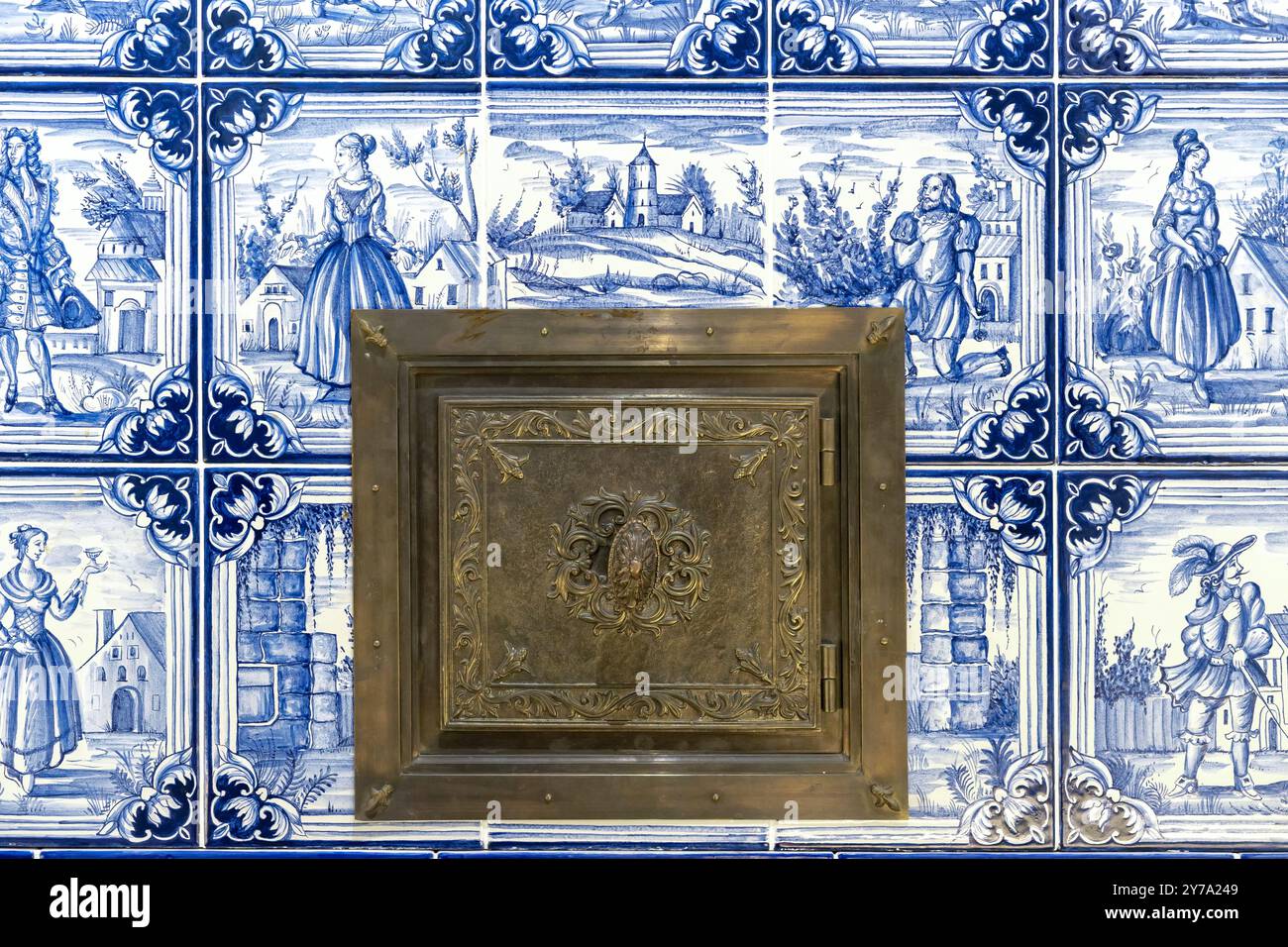 Firebox door of an old stove into which firewood was placed. Stock Photo