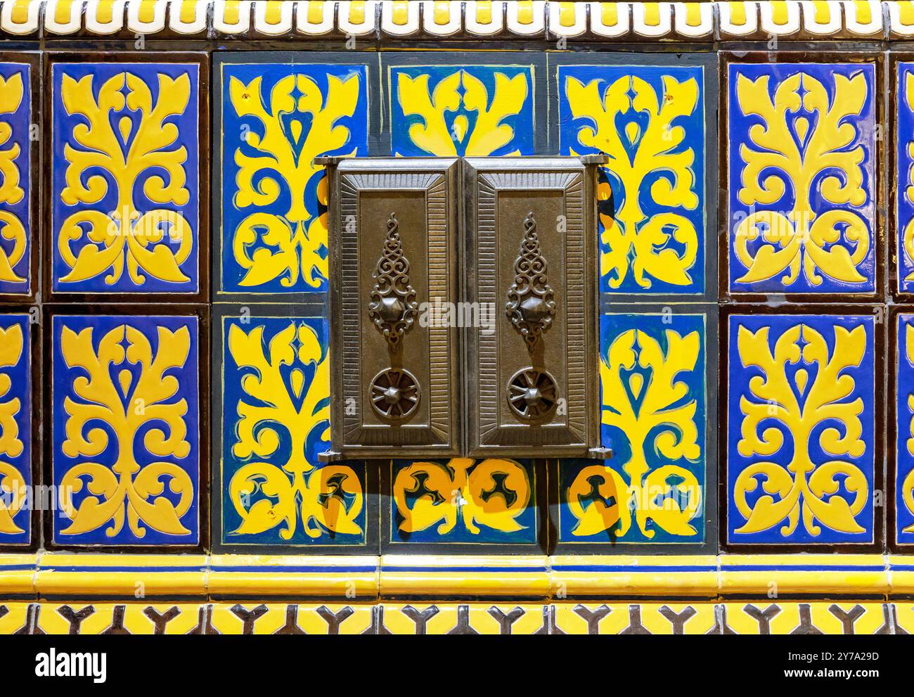 Firebox door of an old stove into which firewood was placed. Stock Photo