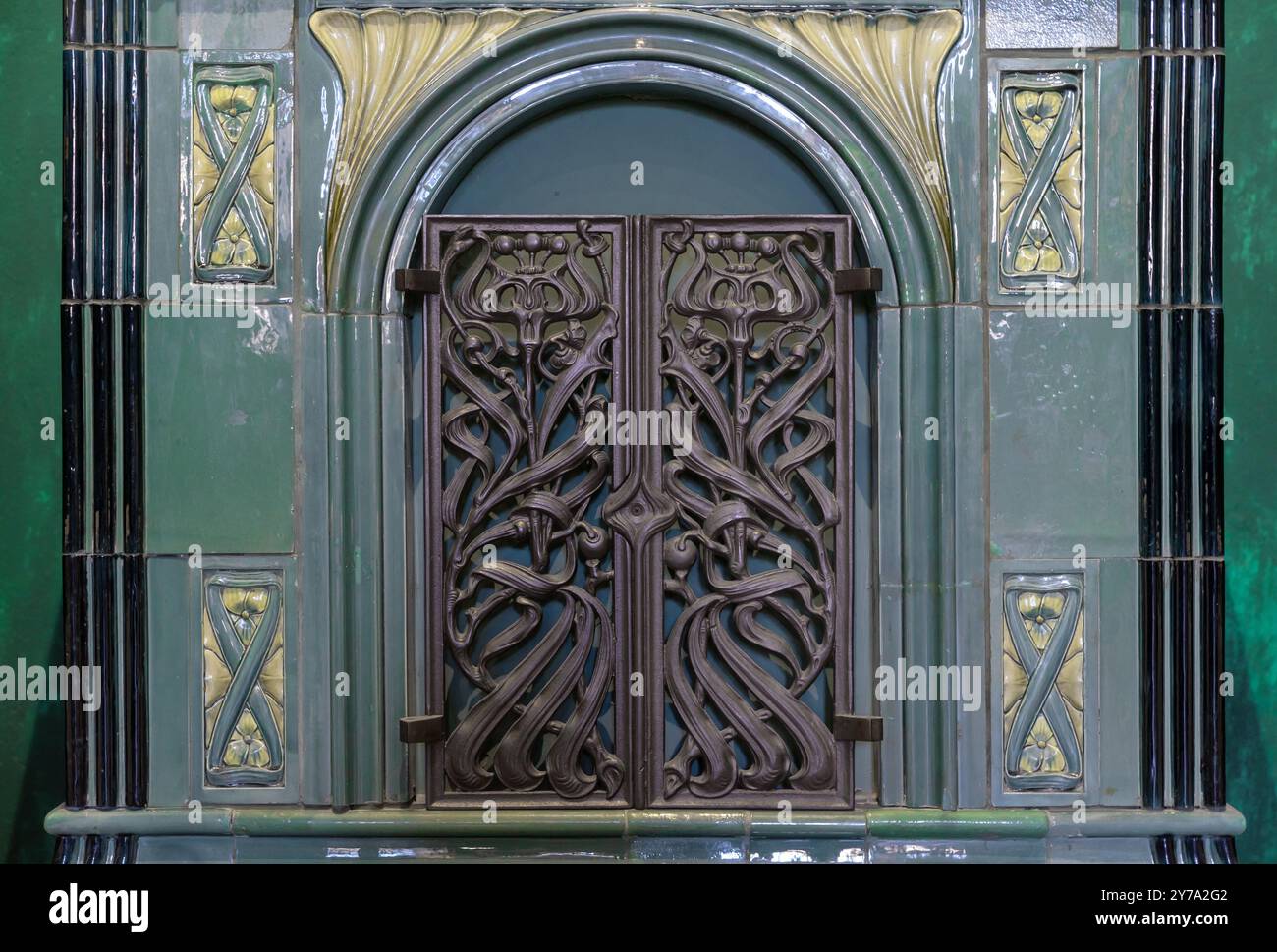 Firebox door of an old stove into which firewood was placed. Stock Photo