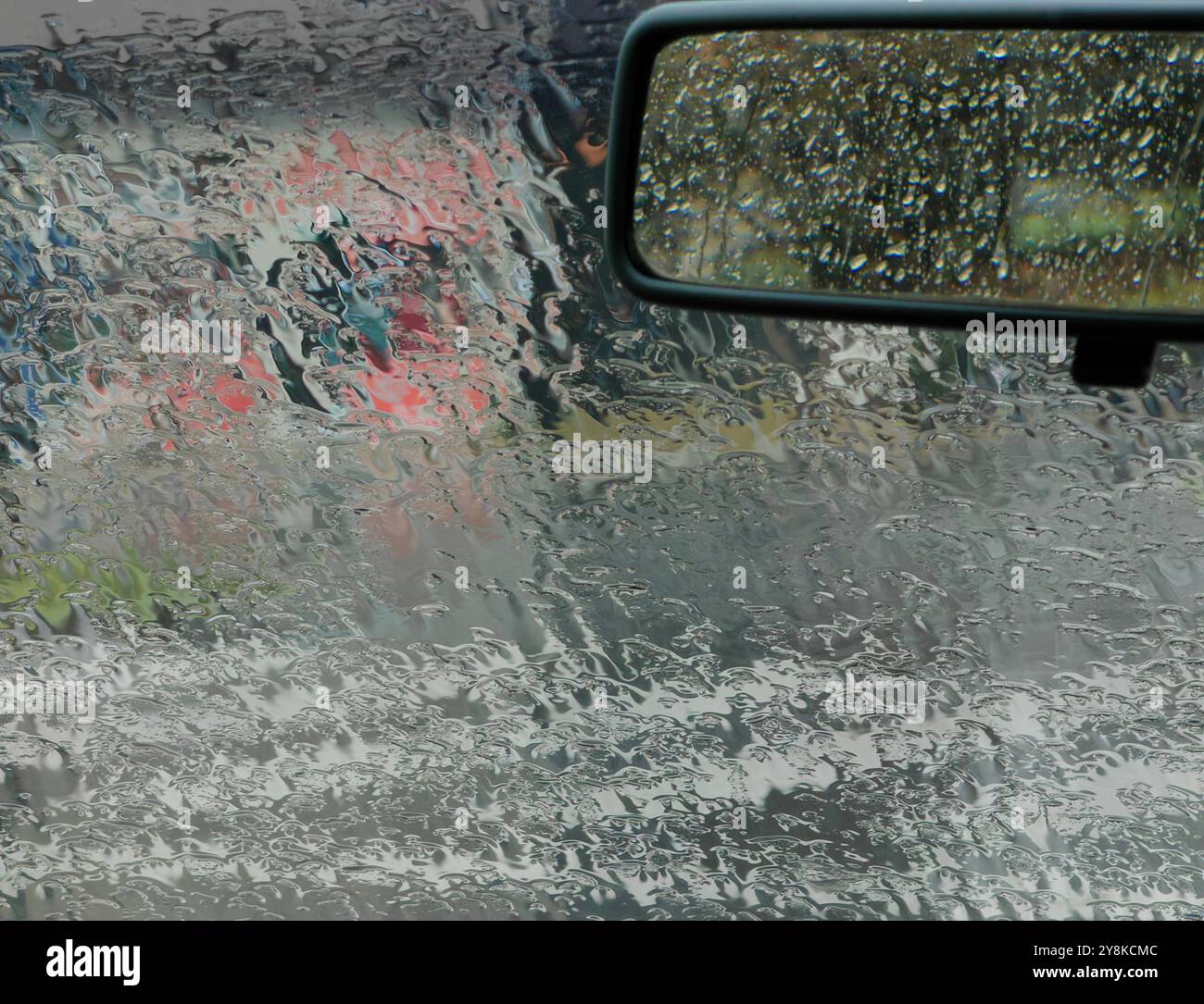 Rainy Day Through the Rear view: Wet Windshield and Creative Framing Stock Photo