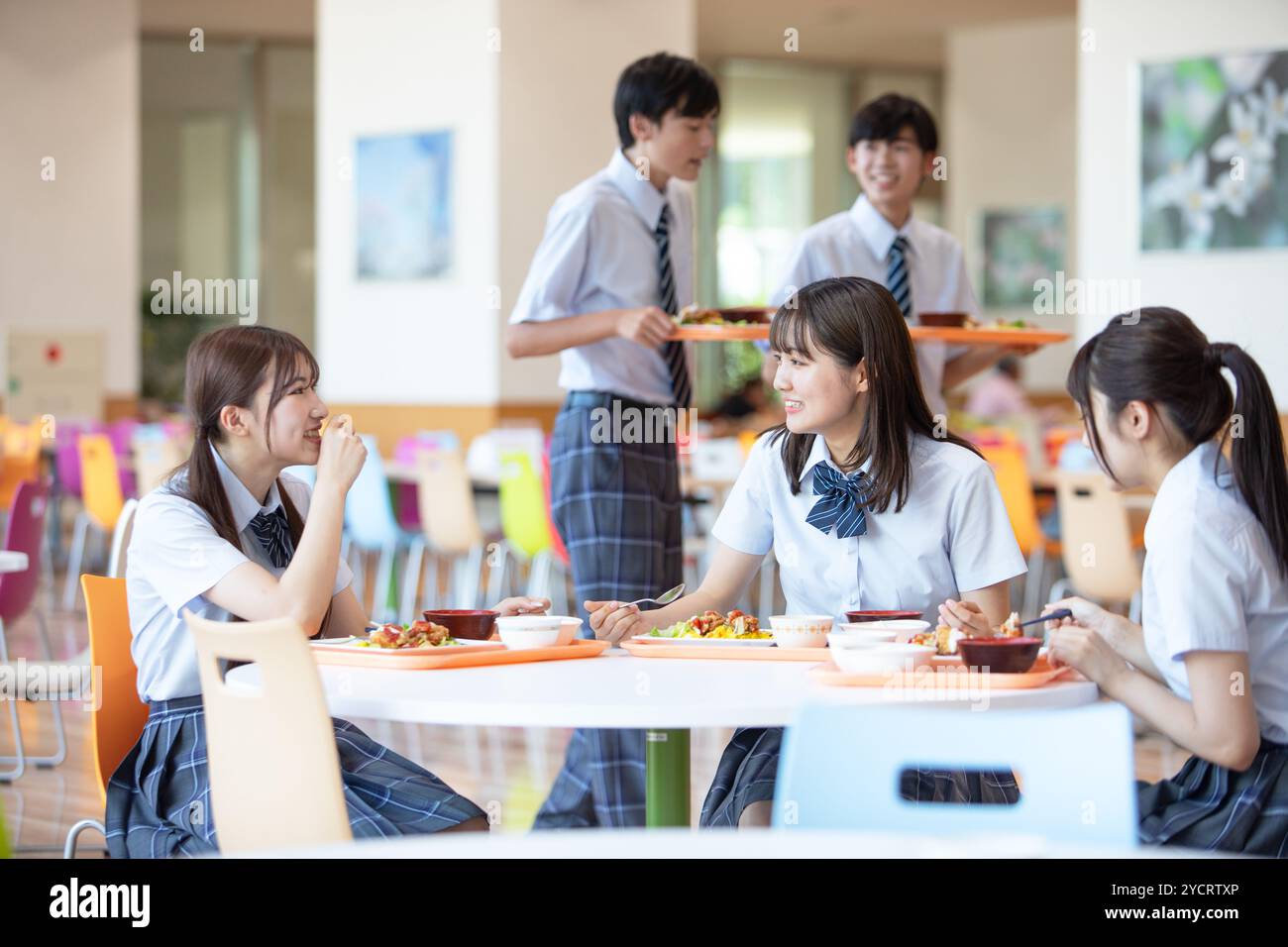 High school students eating in the student cafeteria Stock Photo