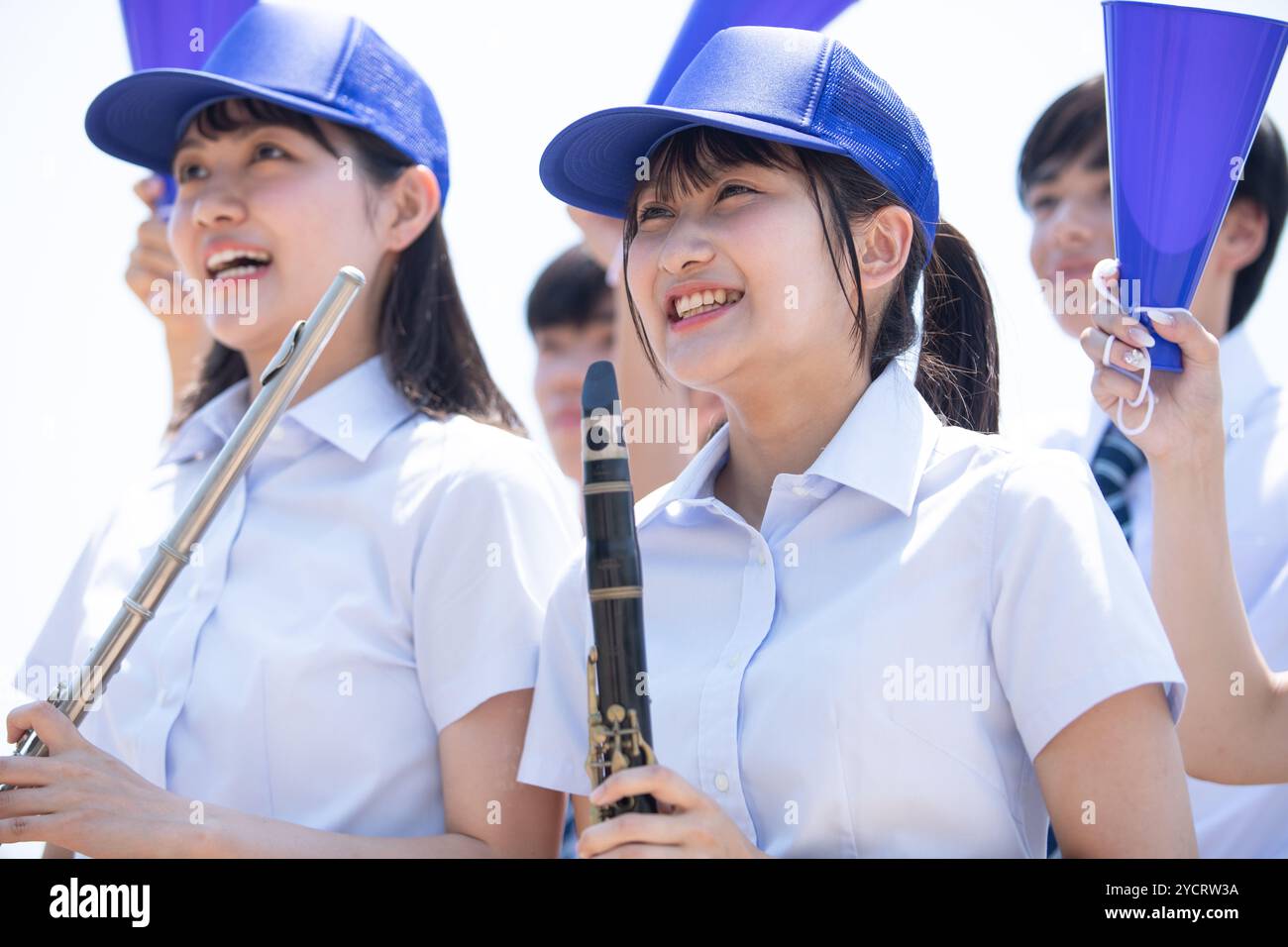 High school students cheering with musical instruments Stock Photo