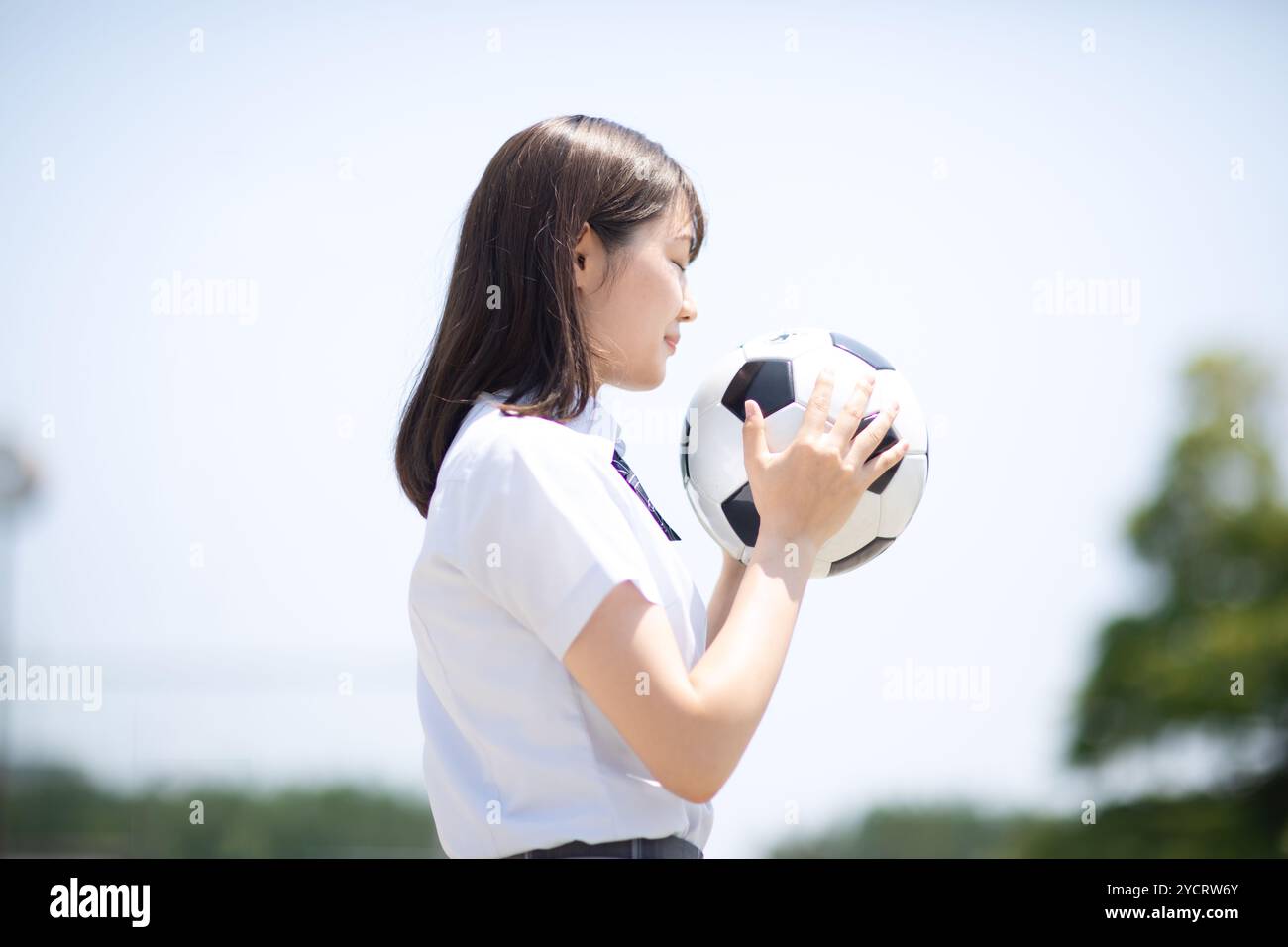 High school student with football Stock Photo