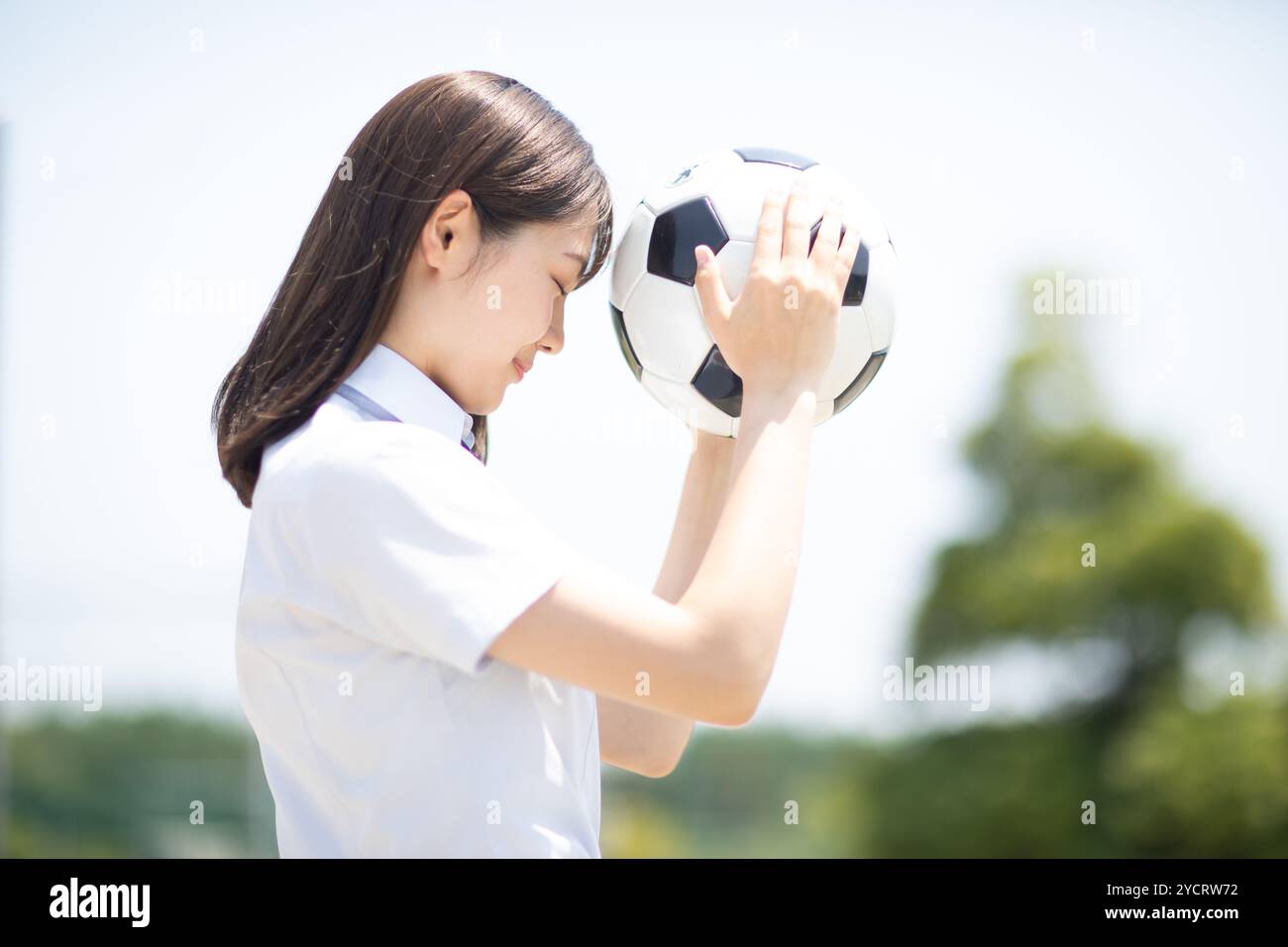 High school student with football Stock Photo