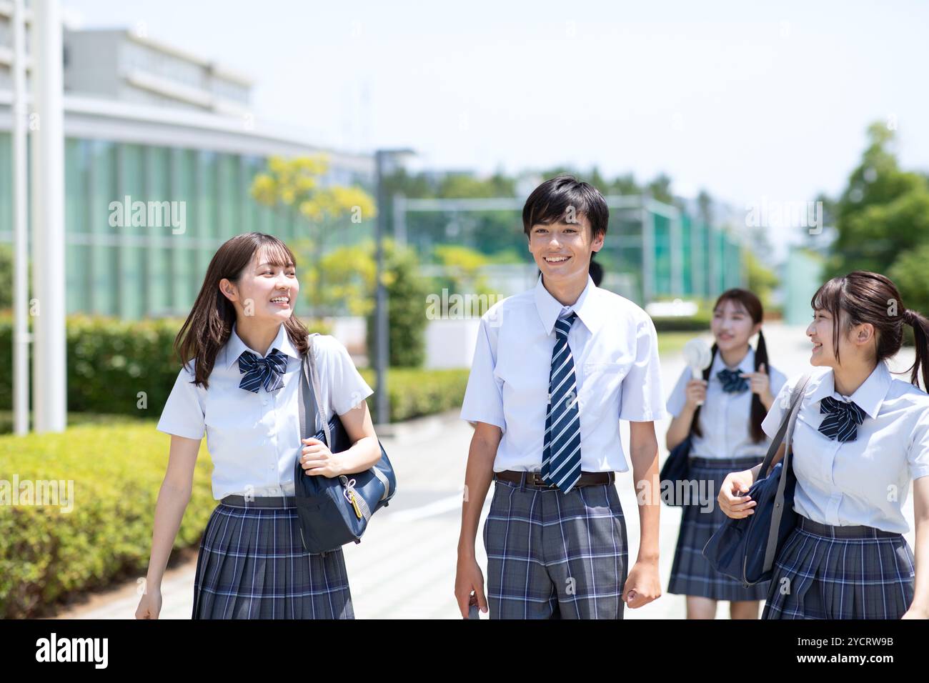 High school students leaving school Stock Photo