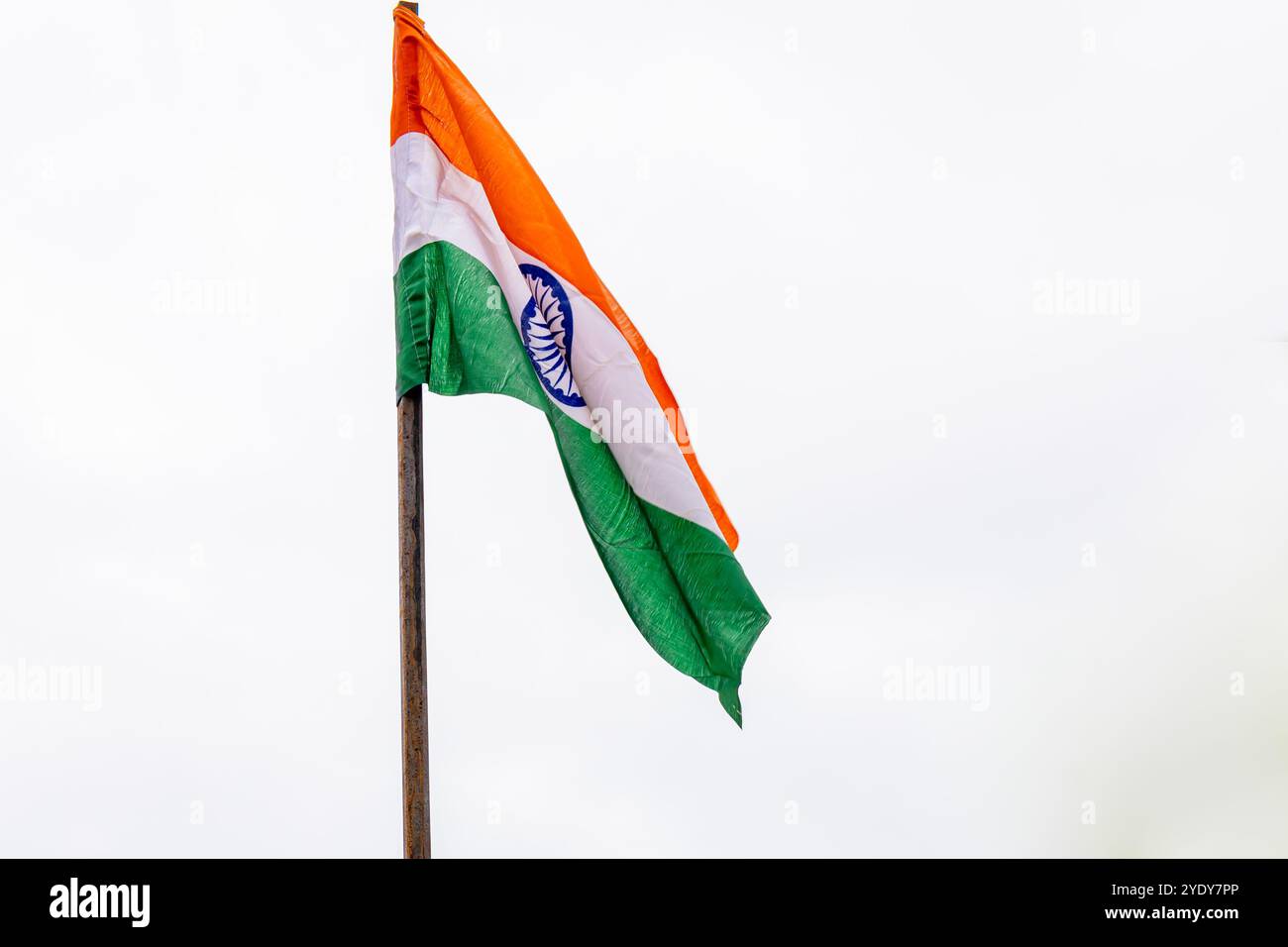 Waving Indian Tricolor Flag Against White Sky Background at Morning Stock Photo