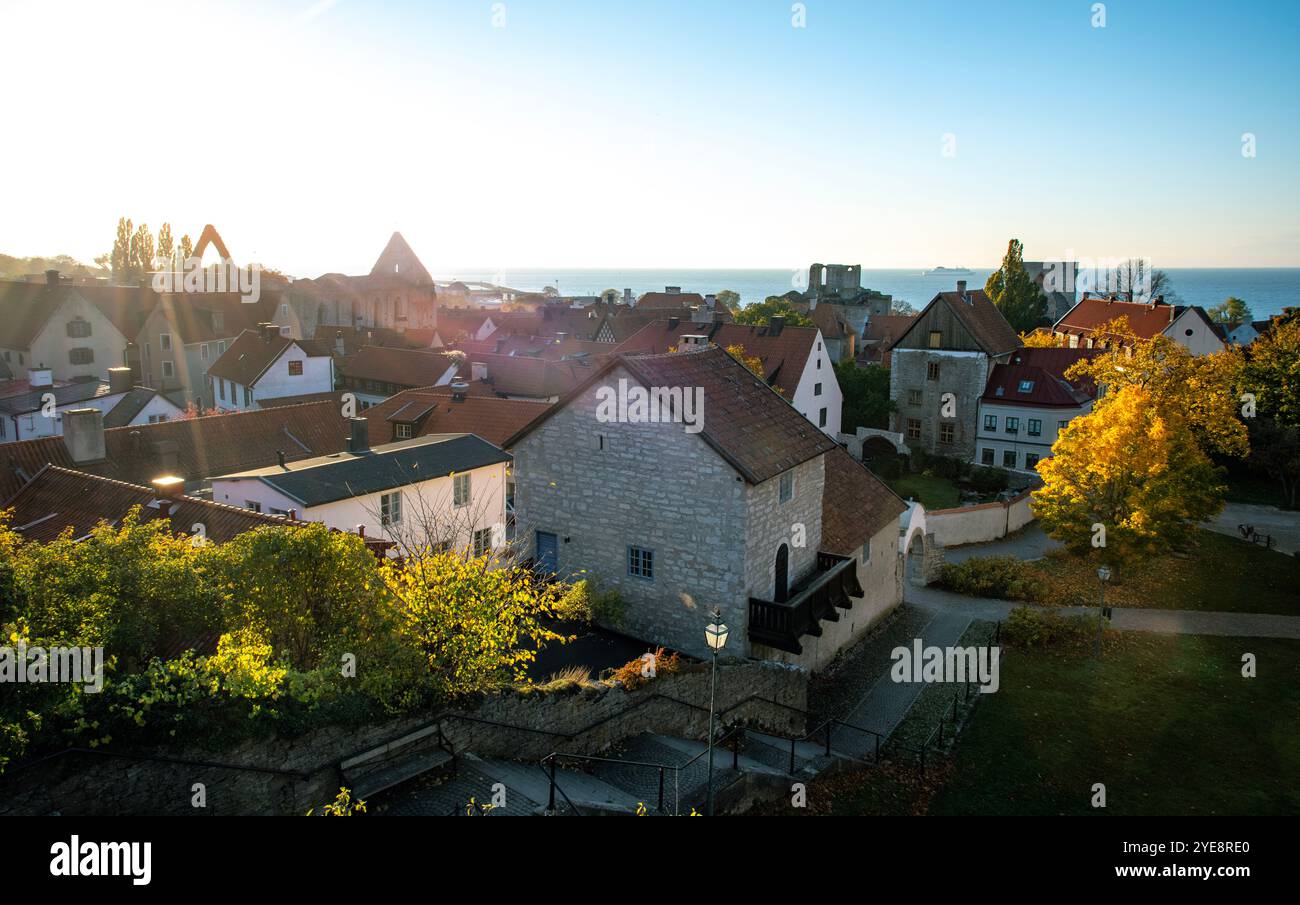 Rooftops and ruins of a medieval church and old houses, Visby, Sweden in autumn Stock Photo