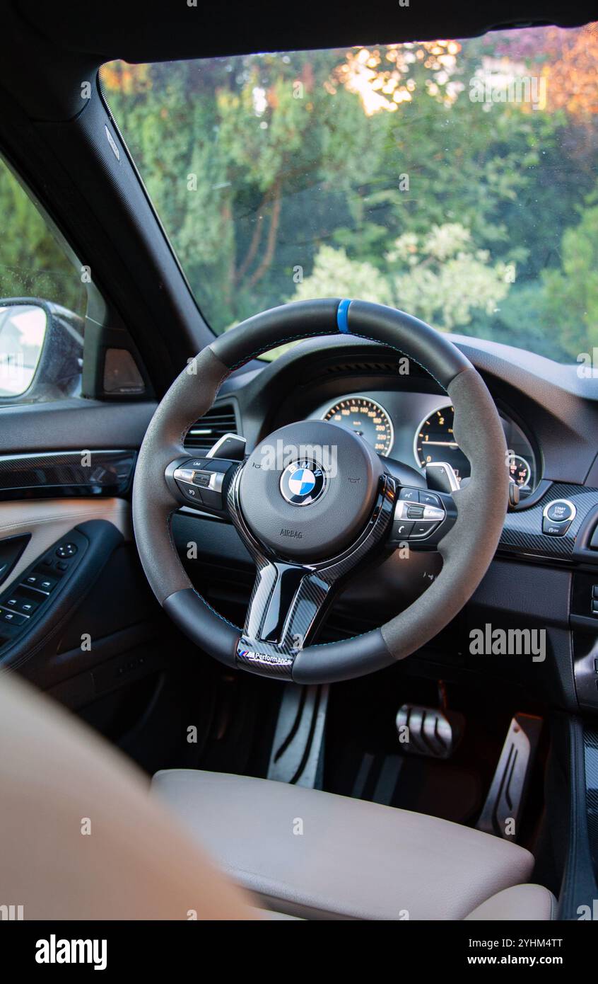 Interior and steering wheel of BMW 5 series, M perfomance, biege seats Stock Photo