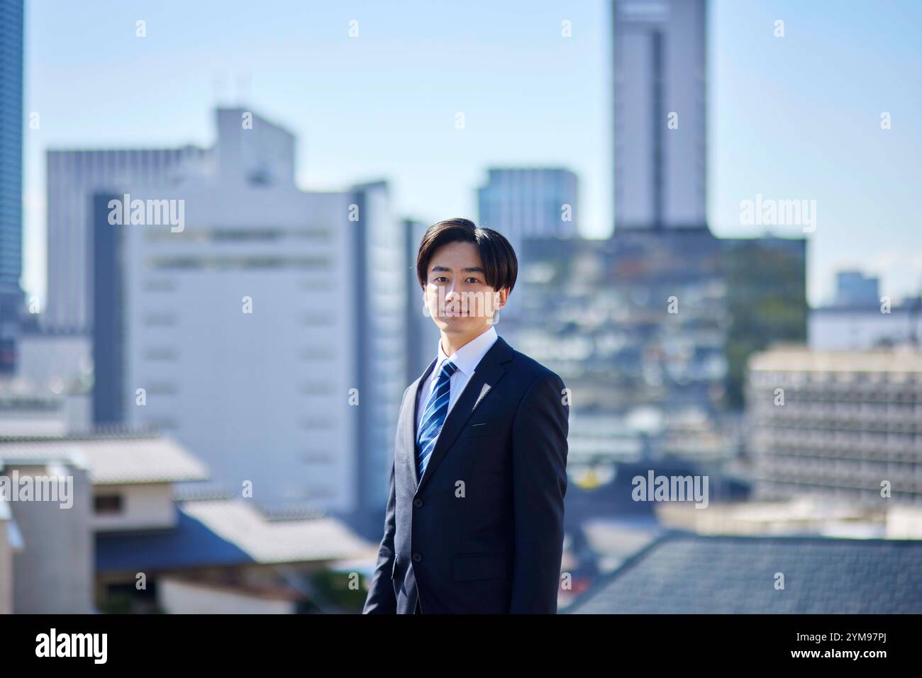 Young businessman in suit and townscape Stock Photo