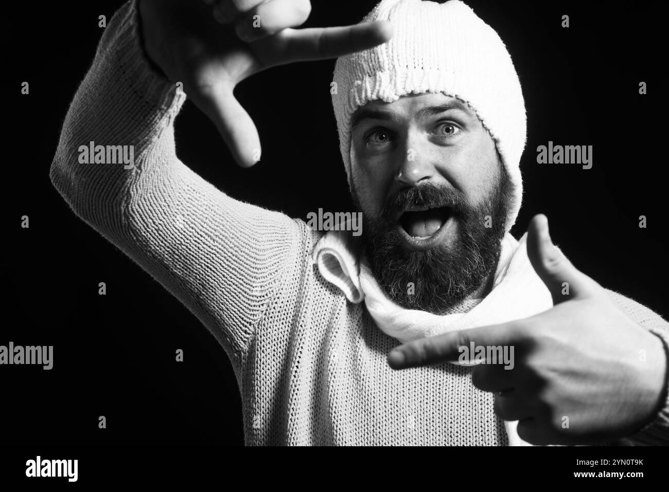 Smiling bearded framing face with hands. Happy man creating frame with fingers. Imaginary selfie photo. Handsome guy in casual wear makes camera frame Stock Photo