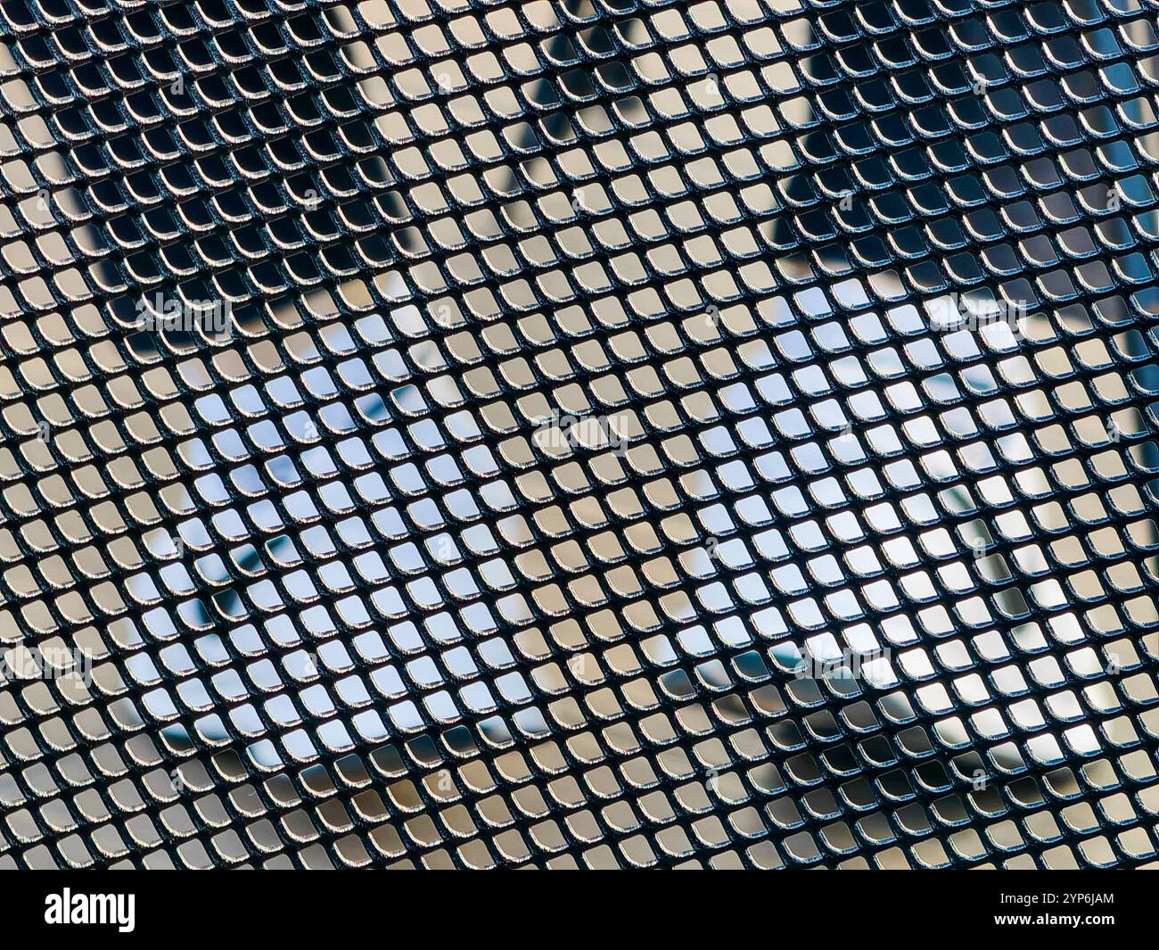 Framed by Design: Nike White Sneakers Through Metal Grid Stock Photo