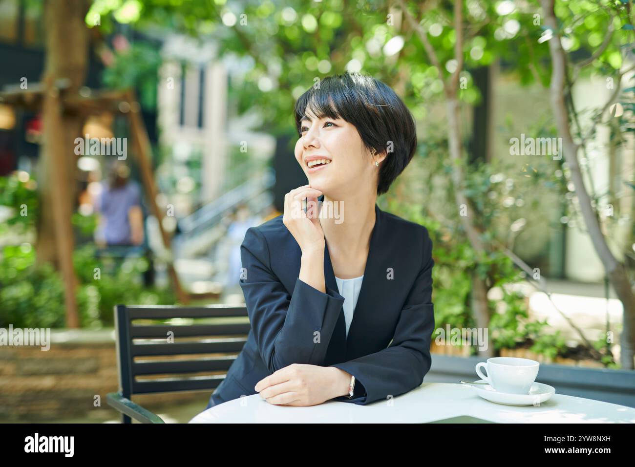 Café, terrace, female office worker in her 30s Stock Photo