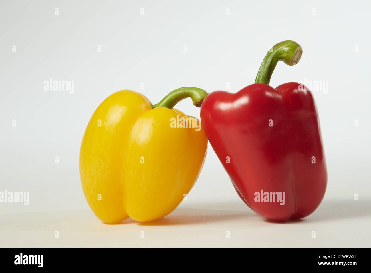 Arranged yellow and red bell peppers Stock Photo