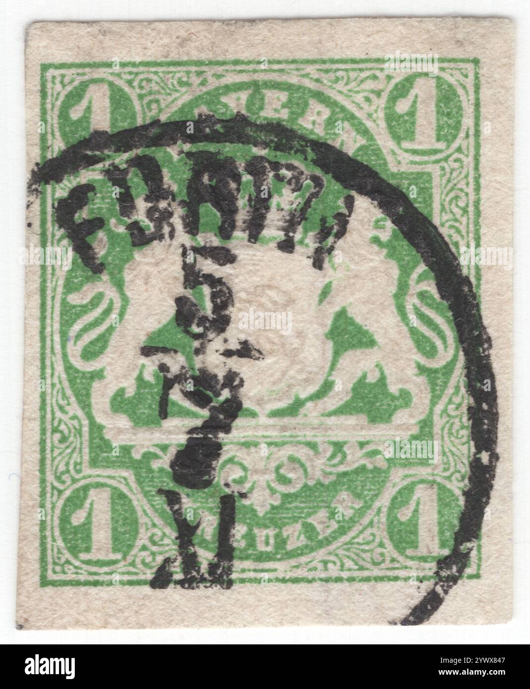 BAVARIA — 1867 January 1: 1kreuzer yellow-green postage stamp depicting Embossed Bayern Coat of Arms with red silk thread and ornament. Bavaria was a Kingdom in the south of Germany with the capital in Munich, member of the German Confederation and became part of the German Empire in 1870. After World War I, it declared itself a republic. It lost its postal autonomy on Mar. 31, 1920 Stock Photo