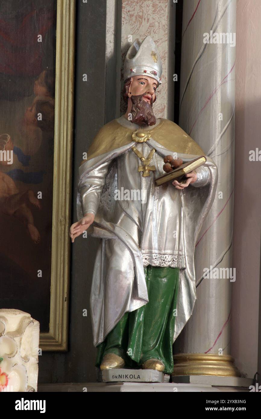 Saint Nicholas, statue on the Altar of the Holy Trinity in the parish church of Saint Michael the Archangel in Miholec, Croatia Stock Photo