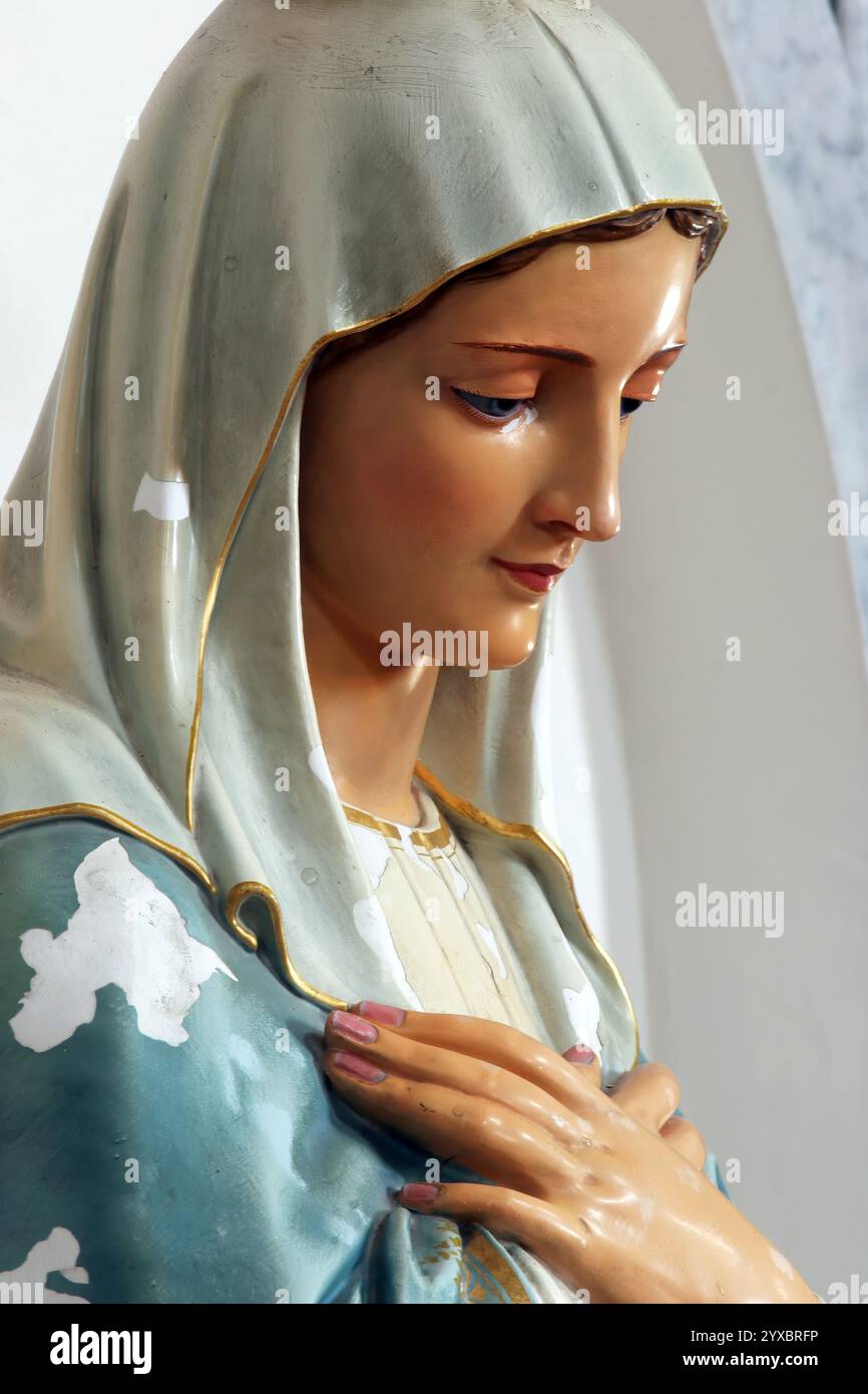 Virgin Mary, statue on the altar in the Church of All Saints in Blato, Korcula island, Croatia Stock Photo