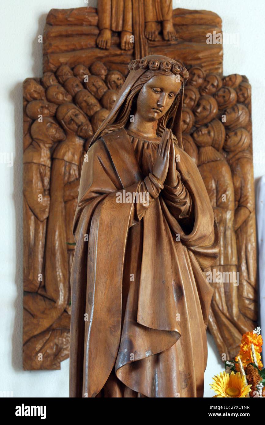 Our Lady, statue on the main altar in the Church of Saint Nicholas Tavelic in Slavonski Brod, Croatia Stock Photo