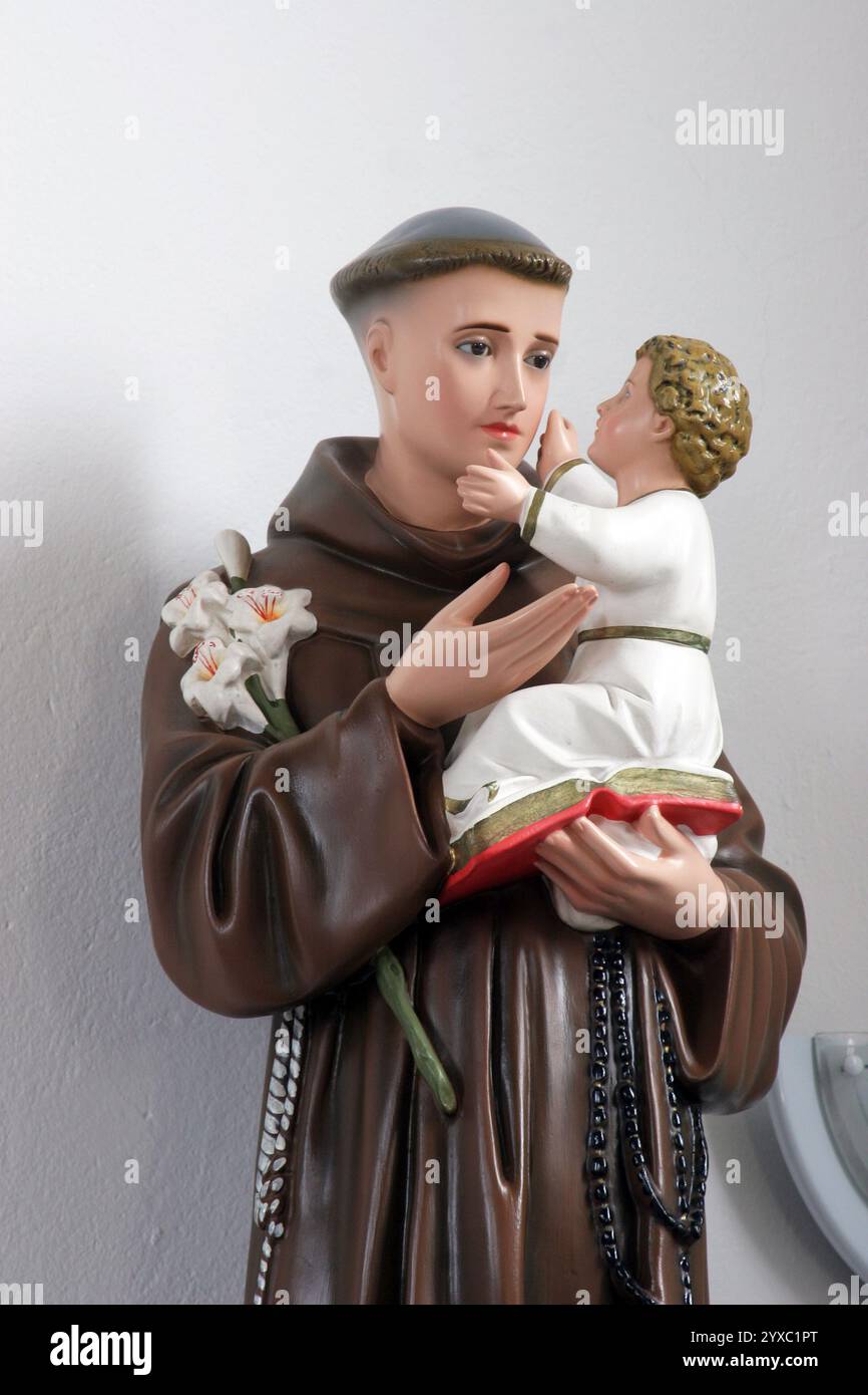 Saint Anthony of Padua with baby Jesus, statue in the parish church of the Saint Joseph the Worker in Slavonski Brod, Croatia Stock Photo