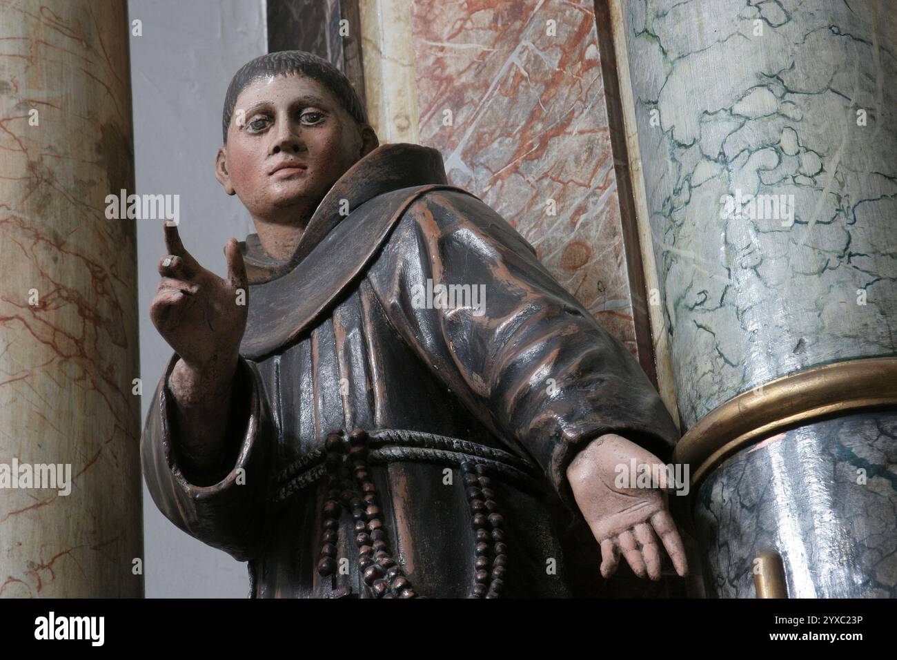 Saint Didacus of Alcala, statue on the altar of Saint Anthony of Padua in the Franciscan Church of the Holy Trinity in Slavonski Brod, Croatia Stock Photo