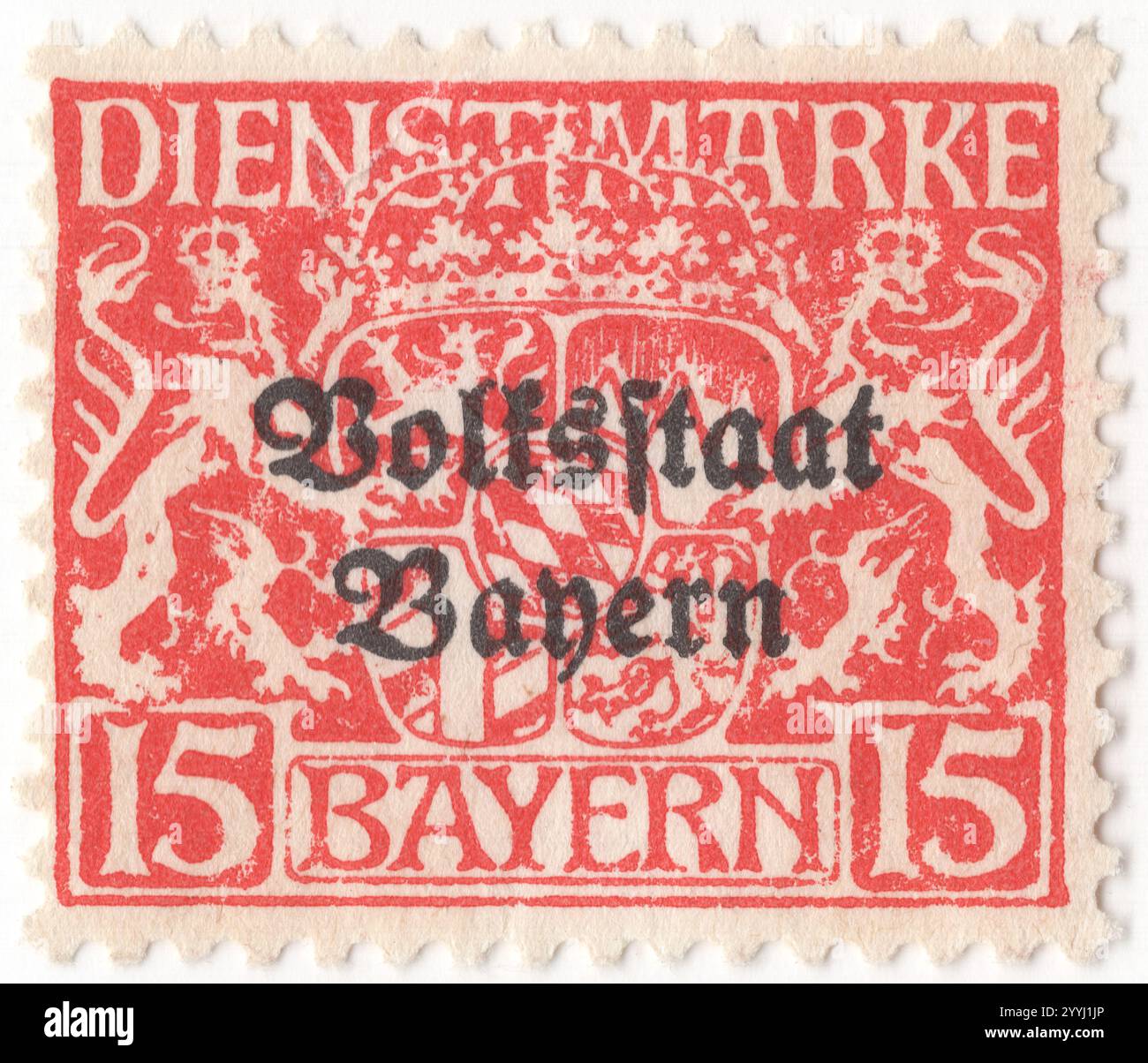 BAVARIA — 1919 March 01: 15 pfennig red Official stamp depicting Bayern State Coat of Arms and ornament. Overprinted 'Volksstaat Bayern'. Bavaria was a Kingdom in the south of Germany with the capital in Munich, member of the German Confederation and became part of the German Empire in 1870. After World War I, it declared itself a republic. It lost its postal autonomy on Mar. 31, 1920 Stock Photo