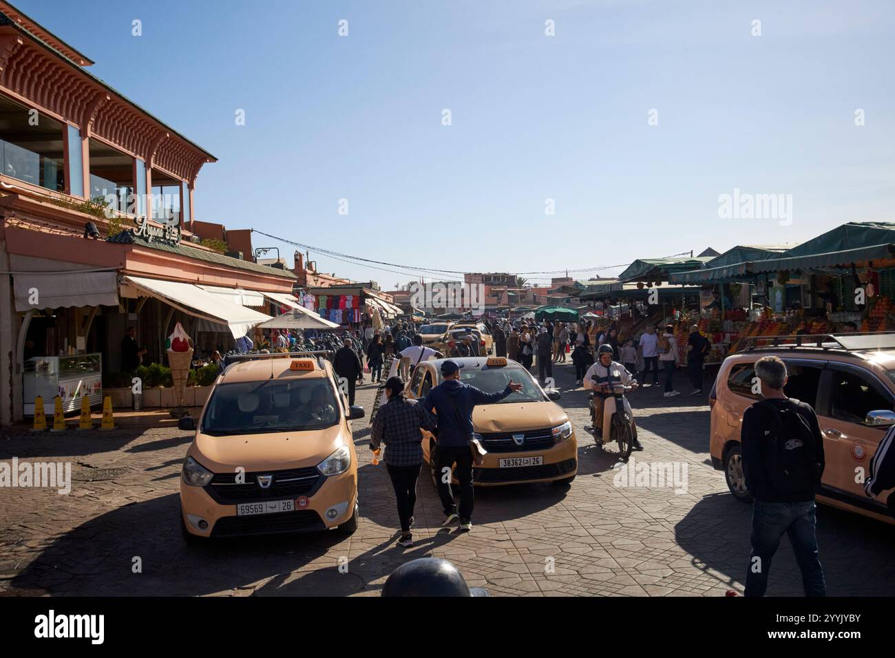 local taxis outside morning pickup points at cafe argana on jemaa el-fna square marrakesh, morocco taxis and tour groups meet here because there are f Stock Photo