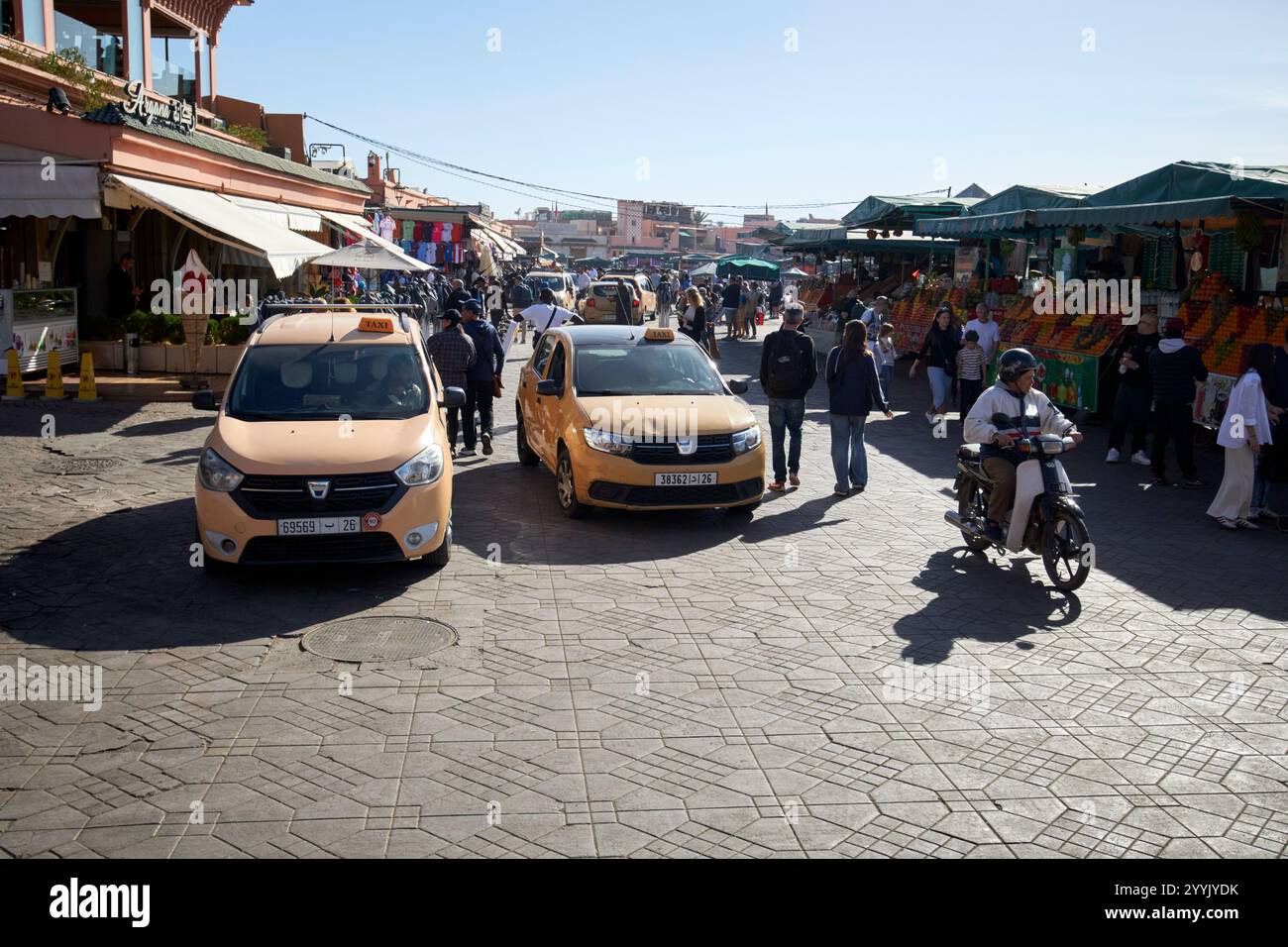 local taxis outside morning pickup points at cafe argana on jemaa el-fna square marrakesh, morocco taxis and tour groups meet here because there are f Stock Photo