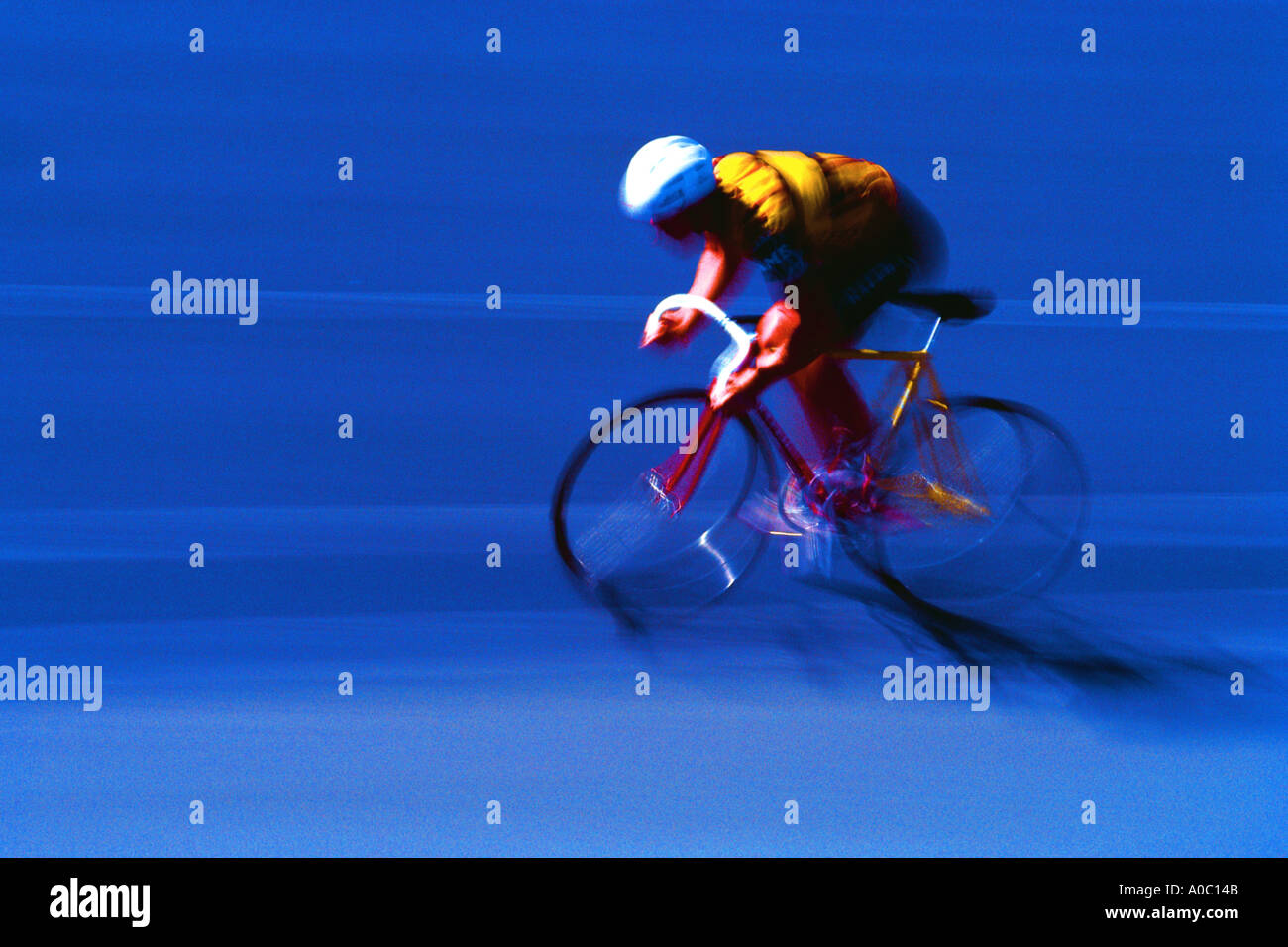 Bicyclist racing on criterium track Stock Photo