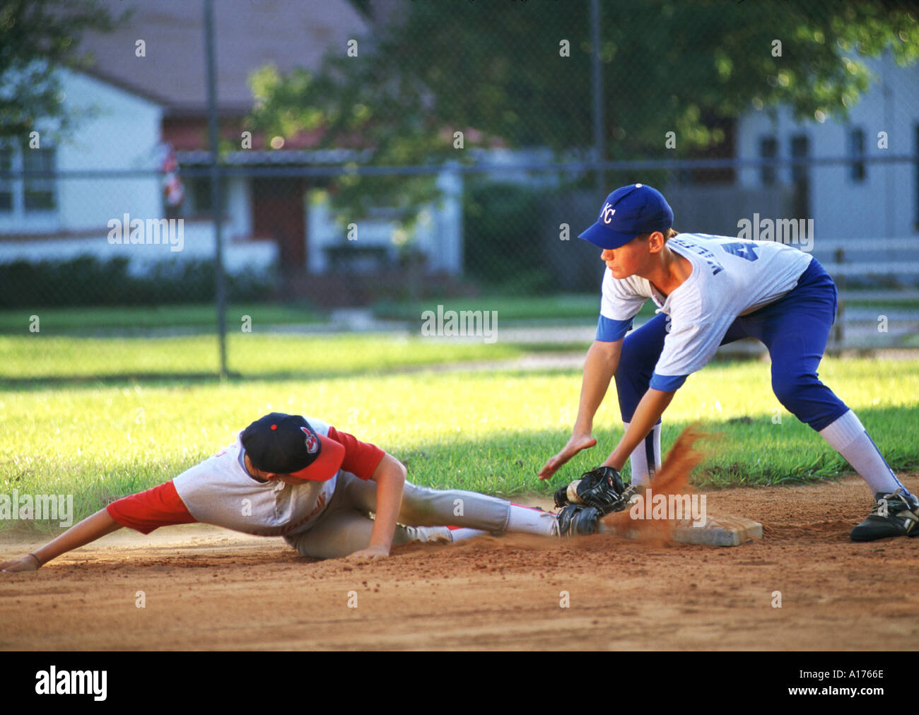 Action Baseball player sliding into base Stock Photo