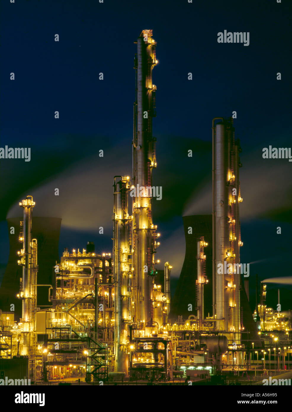 Fractionating column at a petrochemical refinery at night; Grangemouth, Central Region, Scotland, UK. Stock Photo