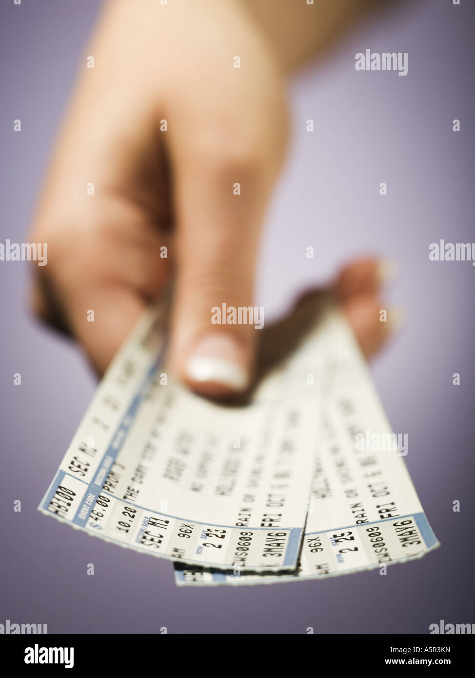 Woman giving tickets Stock Photo