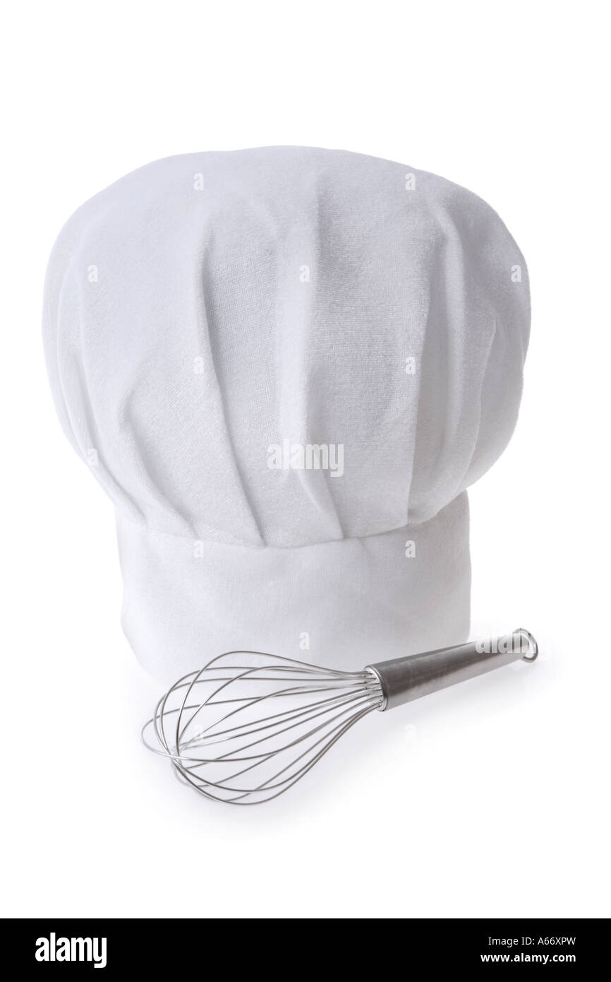 Chef hat and whisk cut out on white background Stock Photo