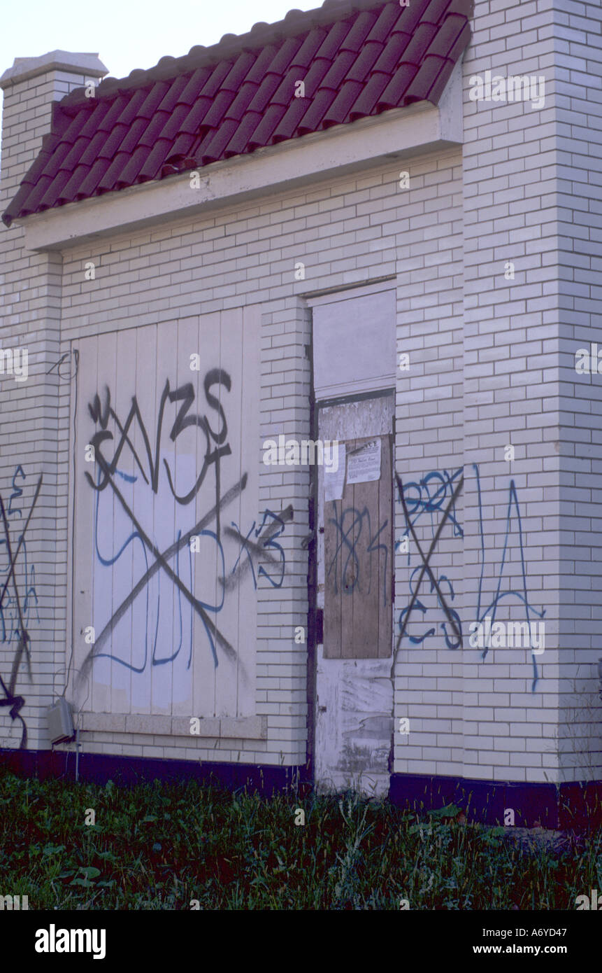 Latino gang graffiti on vacant building Stock Photo