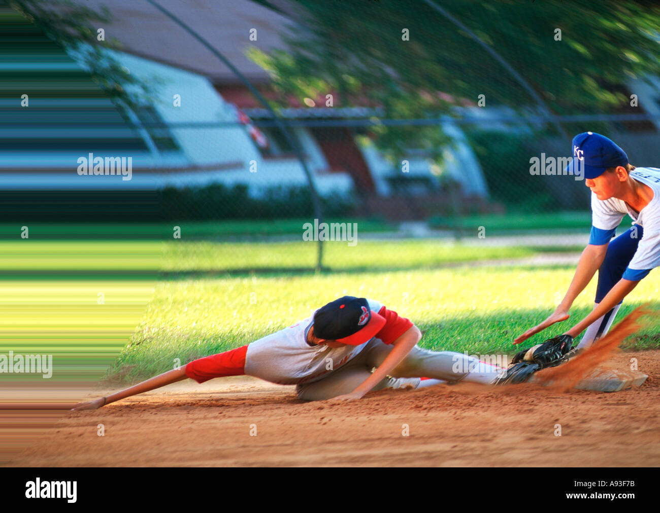 Action Baseball player sliding into base Stock Photo