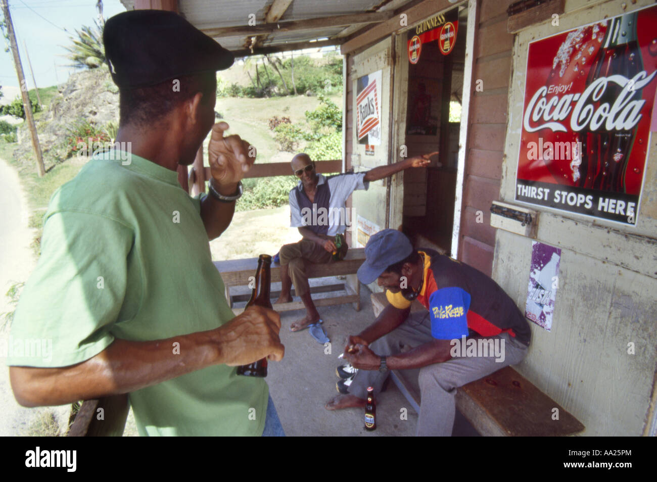 Men relax at a  Rum shack in Bathsheba on the East coast of  Barbados Stock Photo